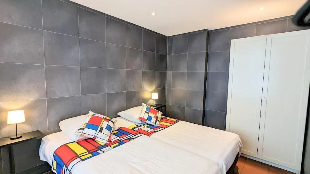 Bed in The Amsterdam Hotel Apartment in the Center