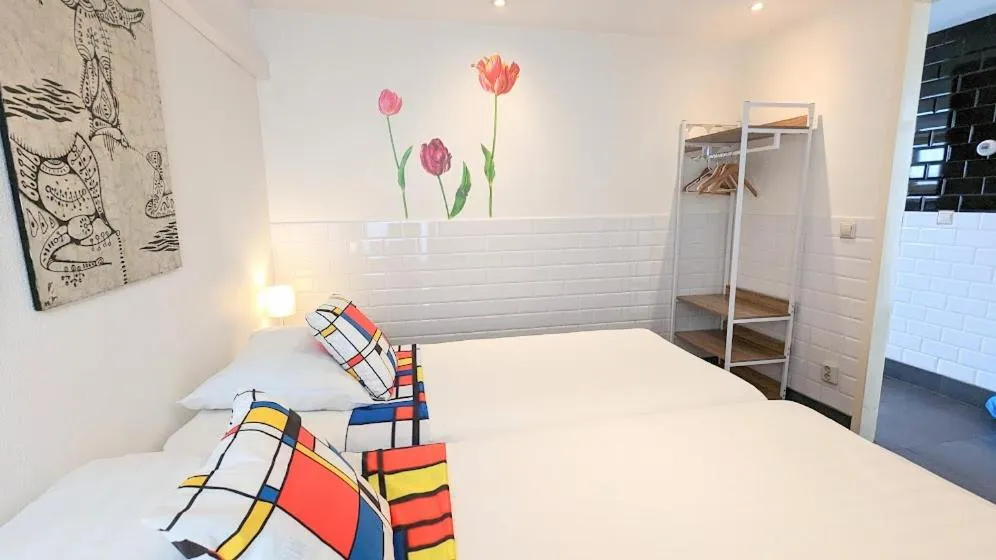 Bed in The Amsterdam Hotel Apartment in the Center