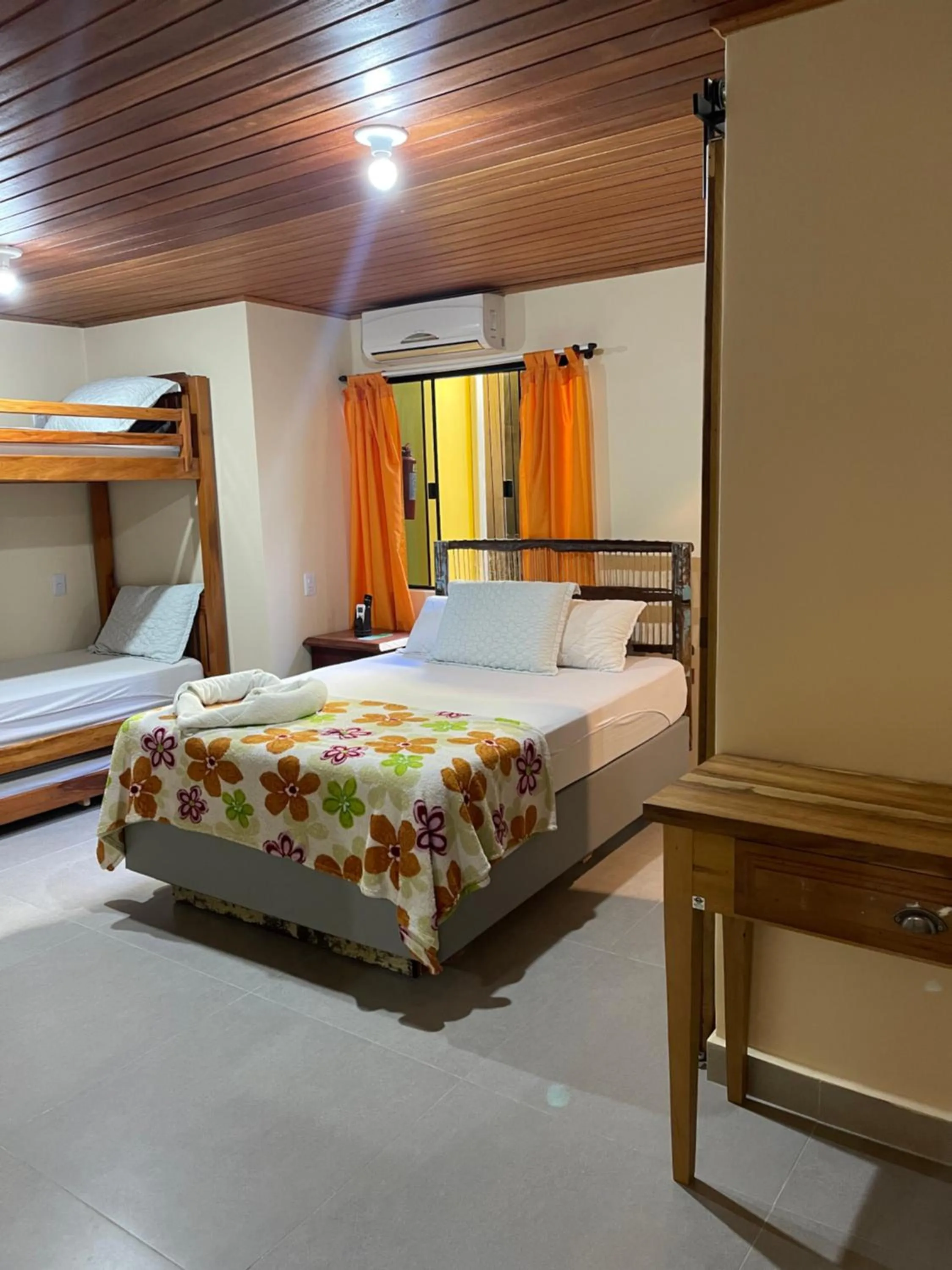 Bed in Pousada Quatro Estrelas