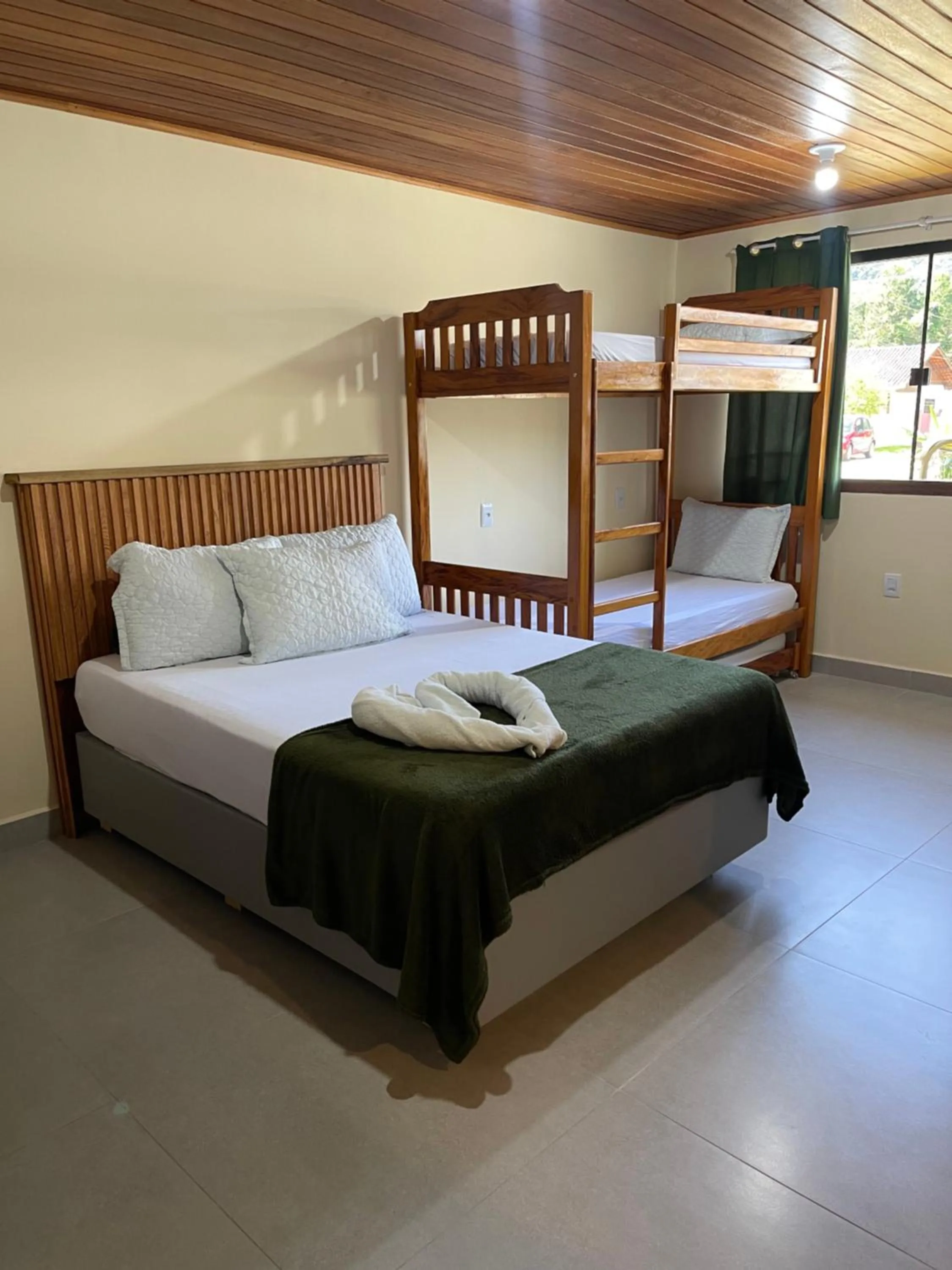 Bed in Pousada Quatro Estrelas