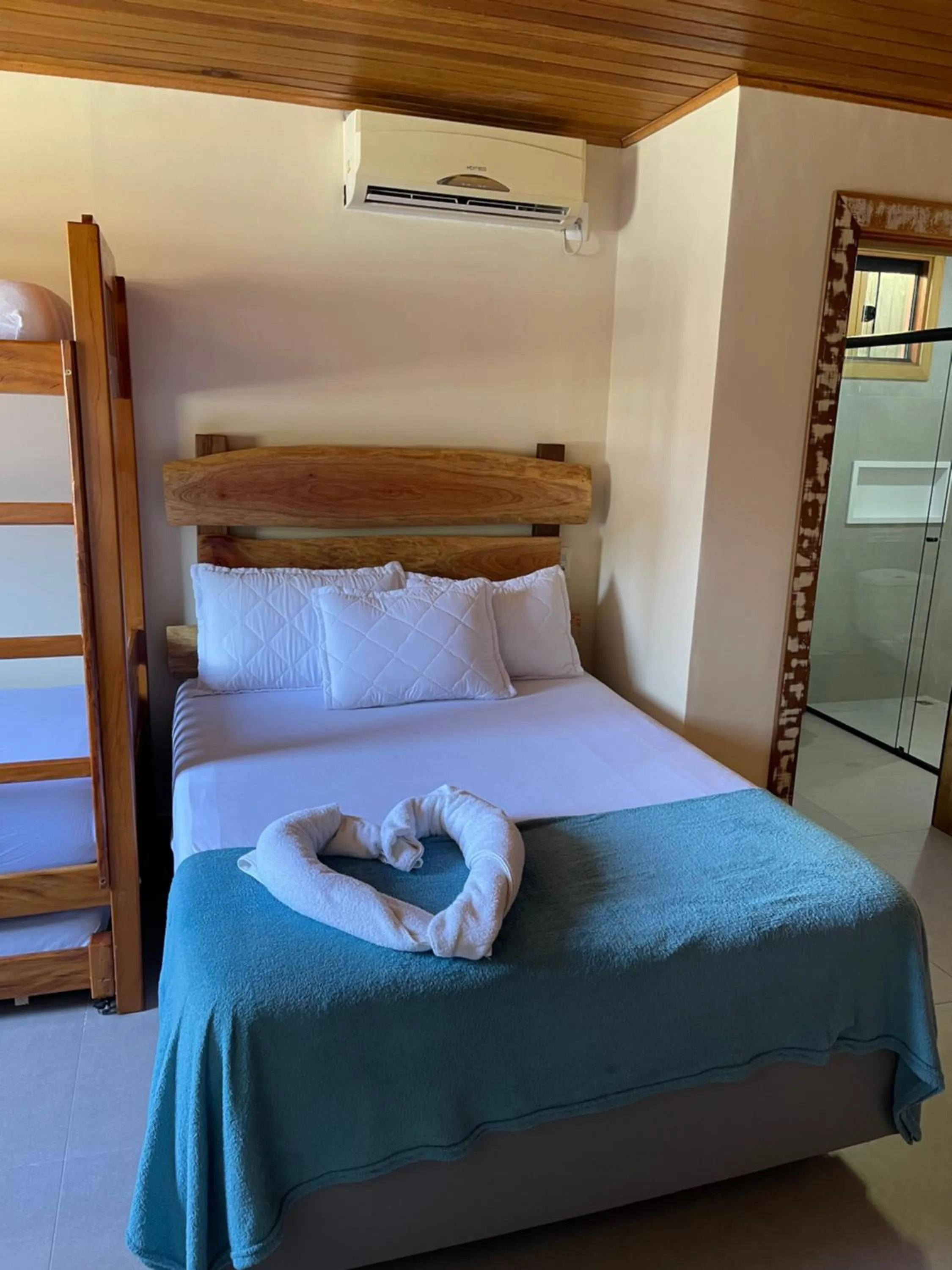 Bed in Pousada Quatro Estrelas