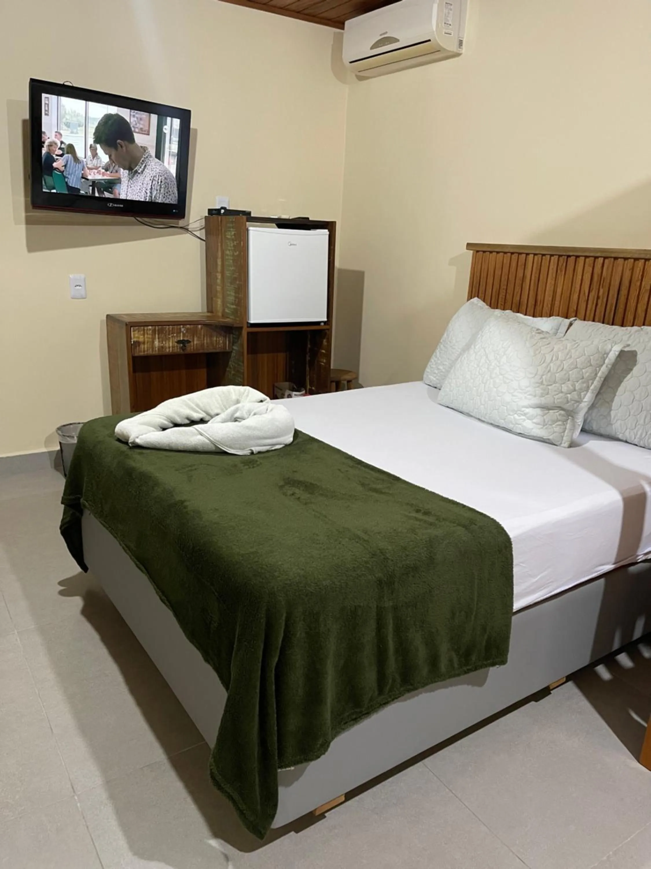 Bed in Pousada Quatro Estrelas