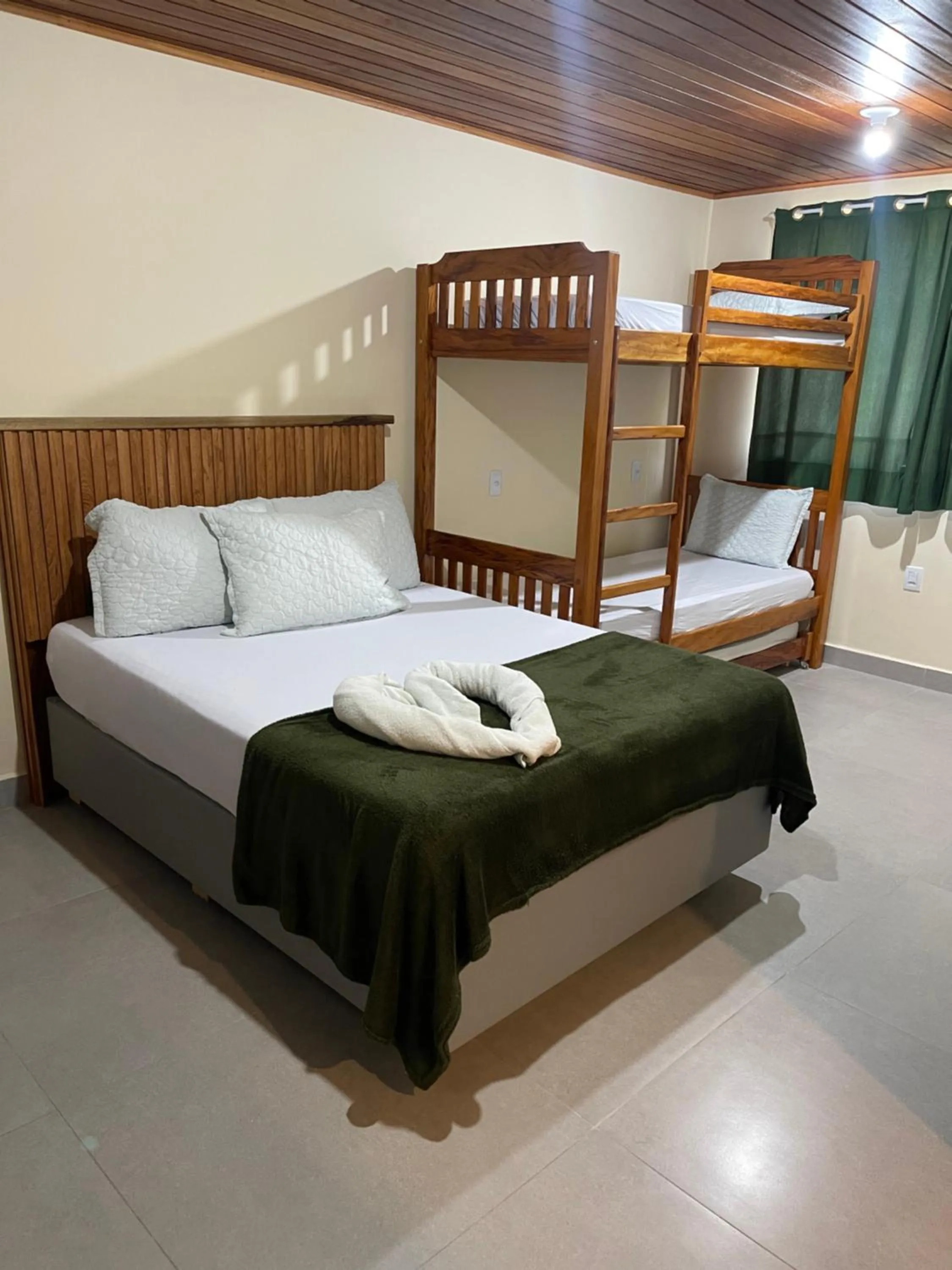 Bed in Pousada Quatro Estrelas