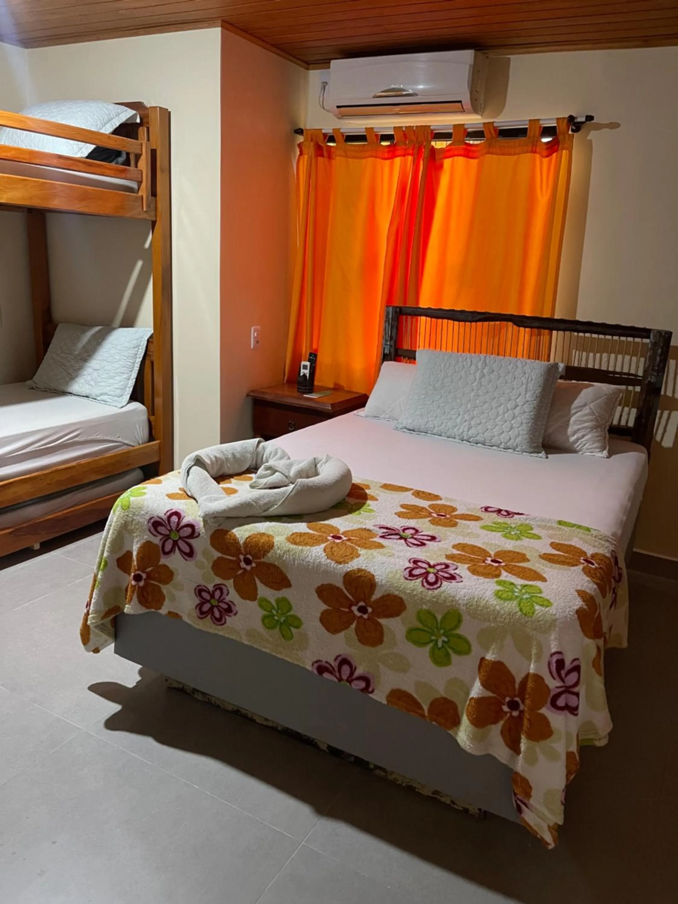 Bed in Pousada Quatro Estrelas