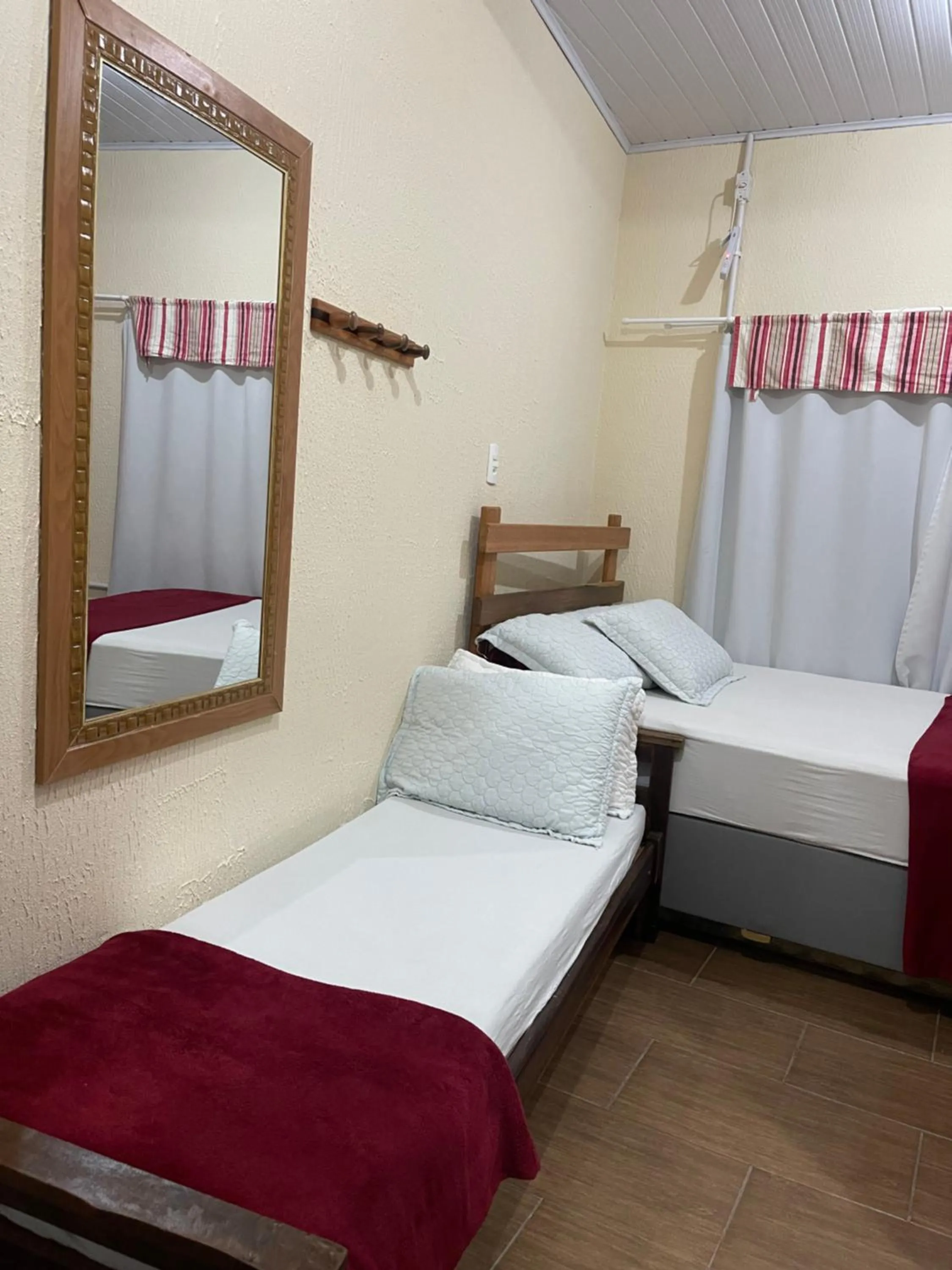 Bed in Pousada Quatro Estrelas