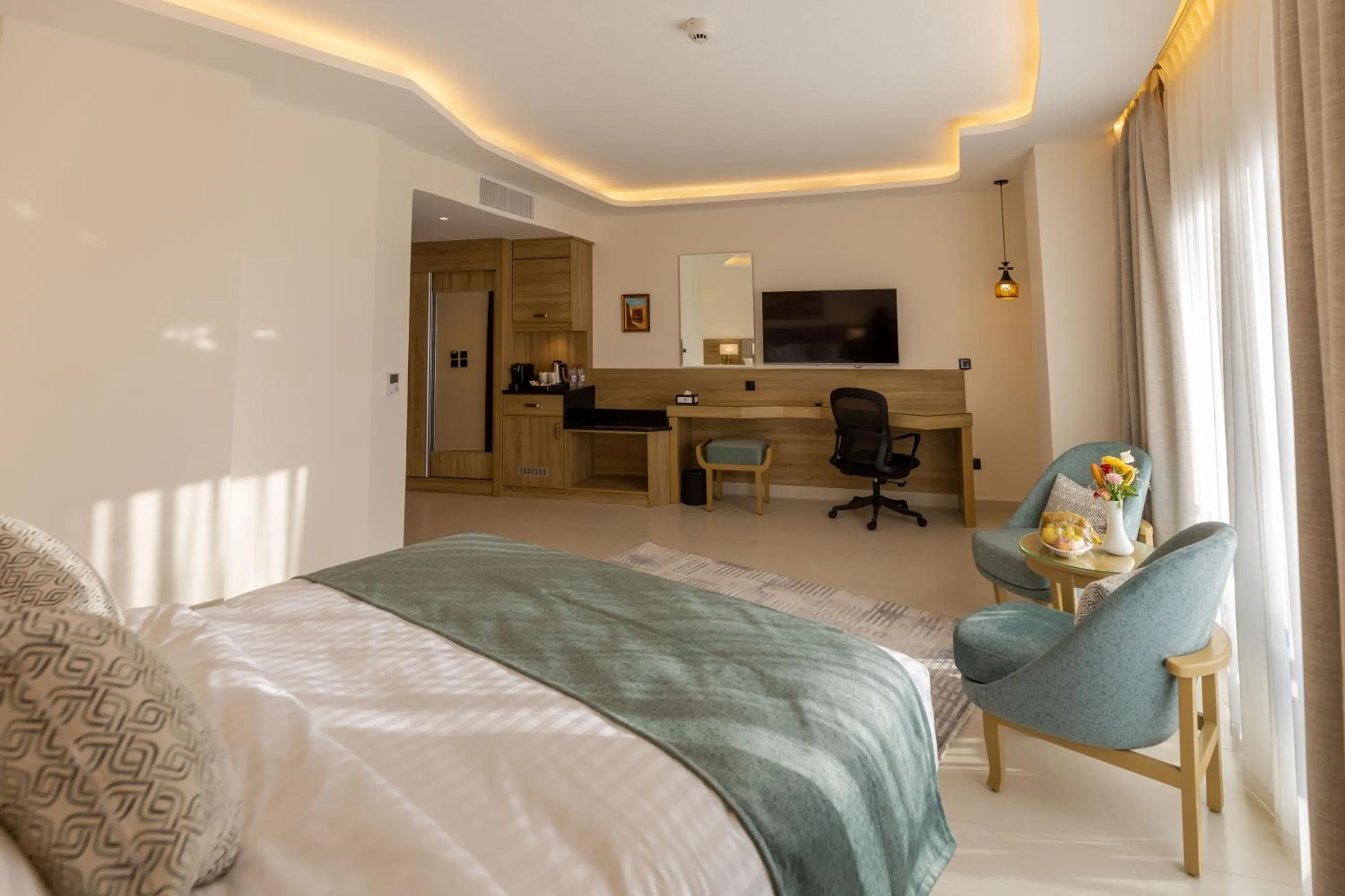 Communal lounge/ TV room, Bed in Petra Legacy Luxury