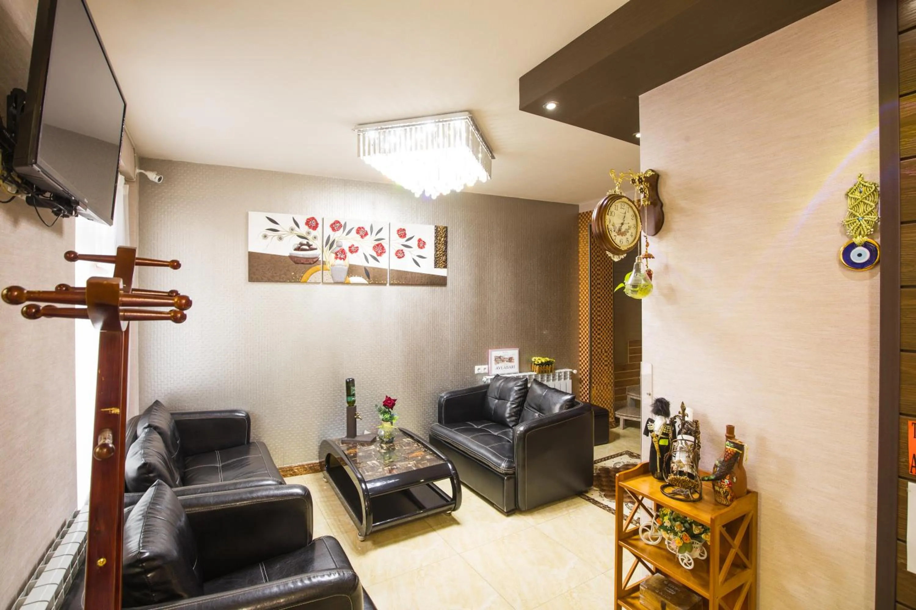 Communal lounge/ TV room in Hotel Garden House