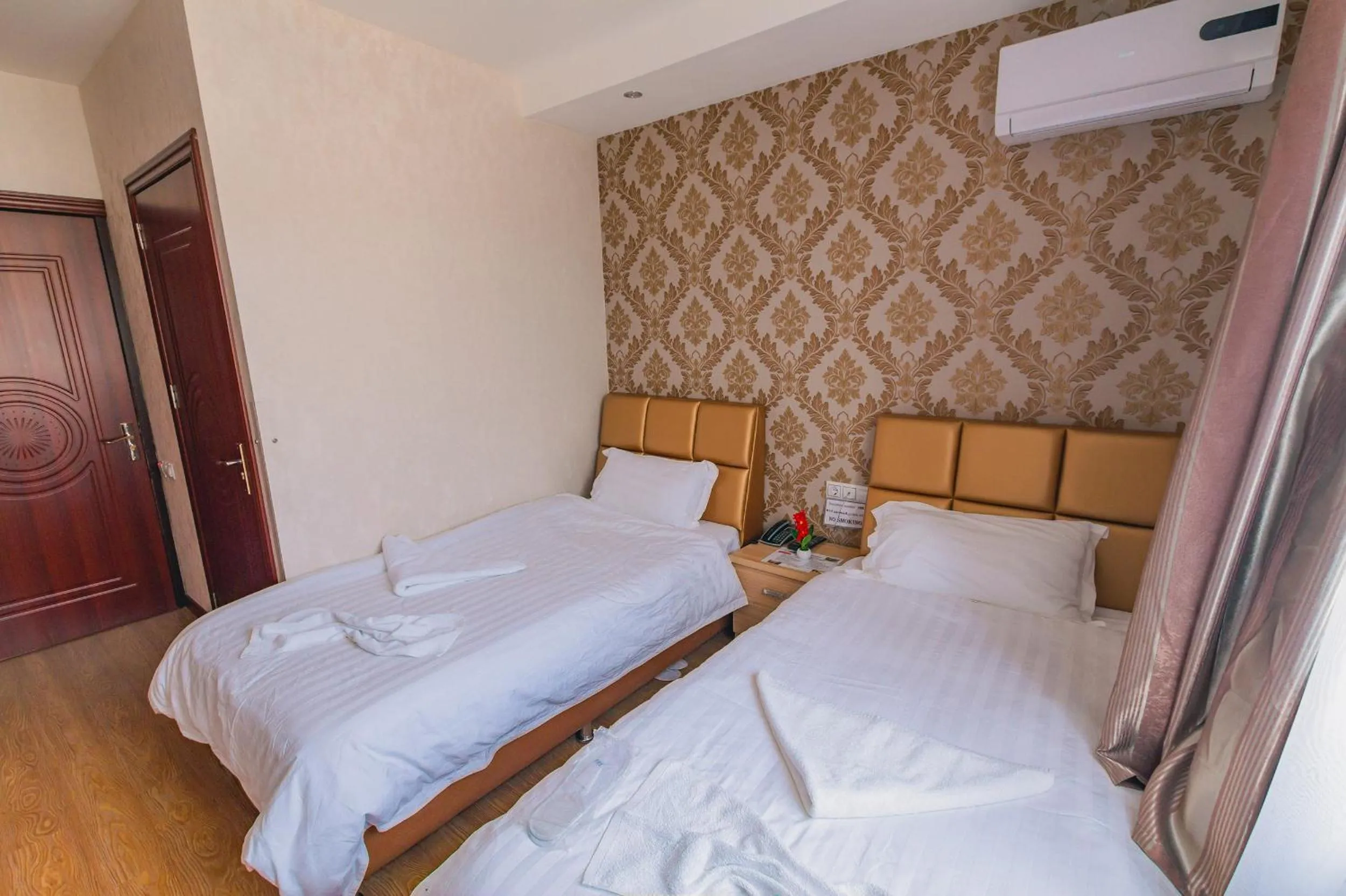 Bed in Hotel Garden House