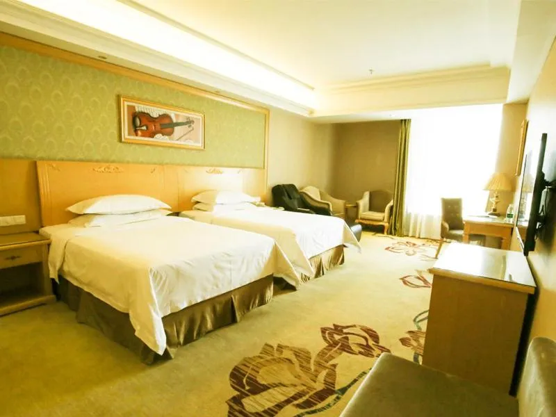 Bed in Vienna Hotel Jiangsu Xuzhou Pengcheng Square