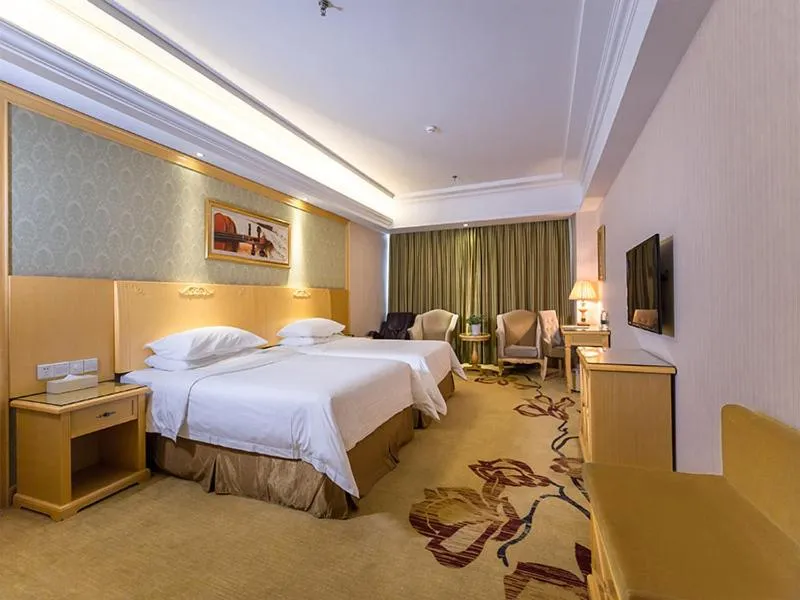 Bed in Vienna Hotel Jiangsu Xuzhou Pengcheng Square