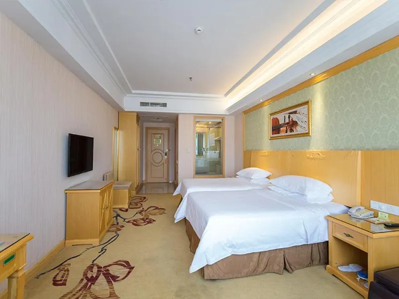 Bed in Vienna Hotel Jiangsu Xuzhou Pengcheng Square