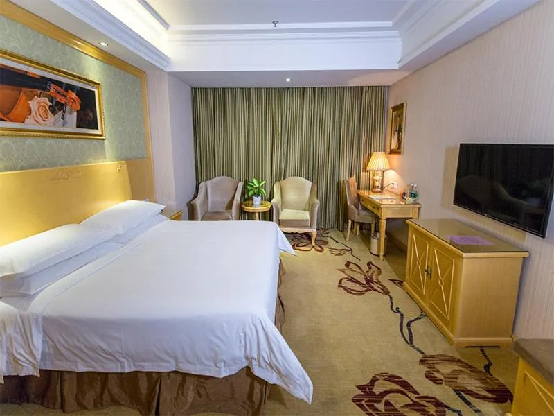 Bed in Vienna Hotel Jiangsu Xuzhou Pengcheng Square