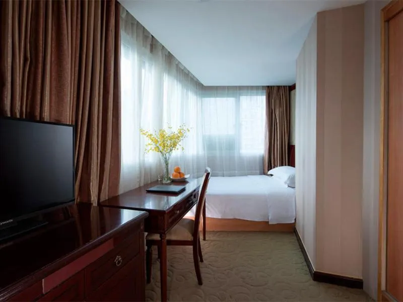 Bed in Vienna Hotel Shenzhen Fenghuang Road