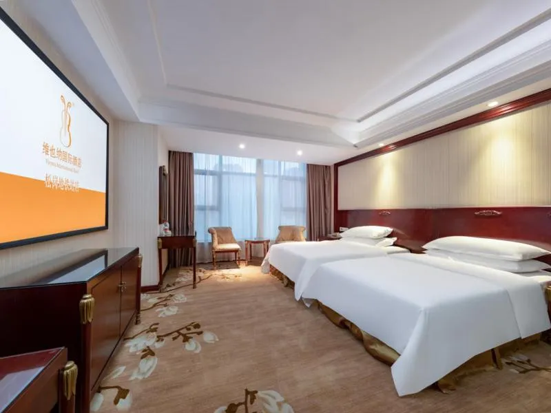 Bed in Vienna Hotel Shenzhen Songgang Shajiang Road