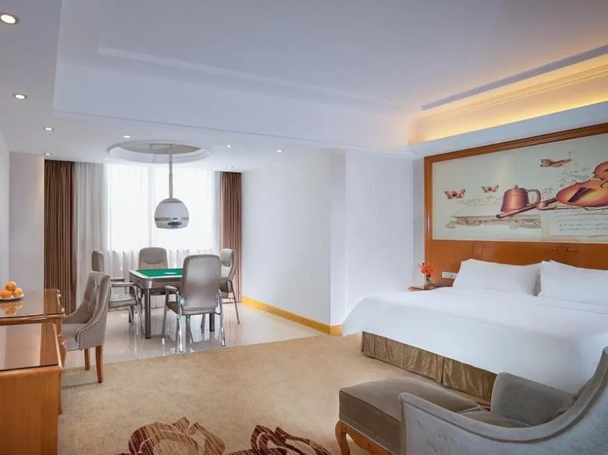 Bed in Vienna Hotel Dongguan Mayong Centre Avenue