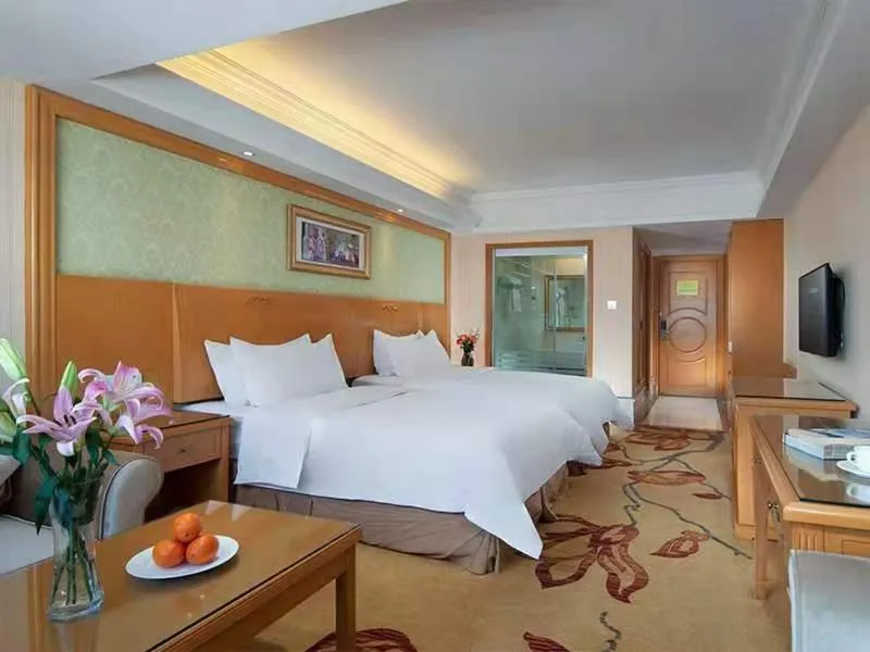 Bed in Vienna International Hotel Lijiang Yuxue Avenue