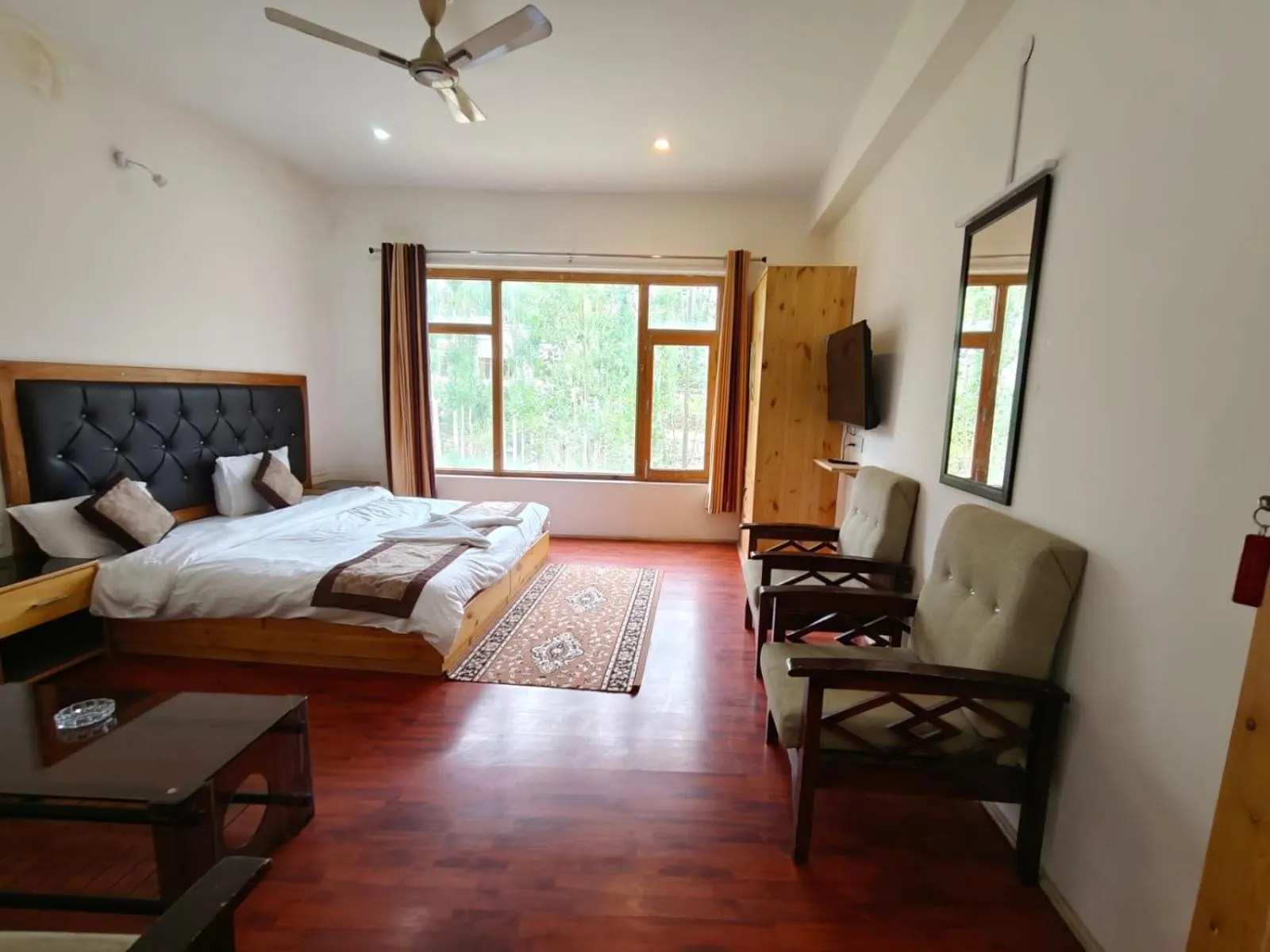 Seating area, Bed in Hotel Sambhava Inn, Leh