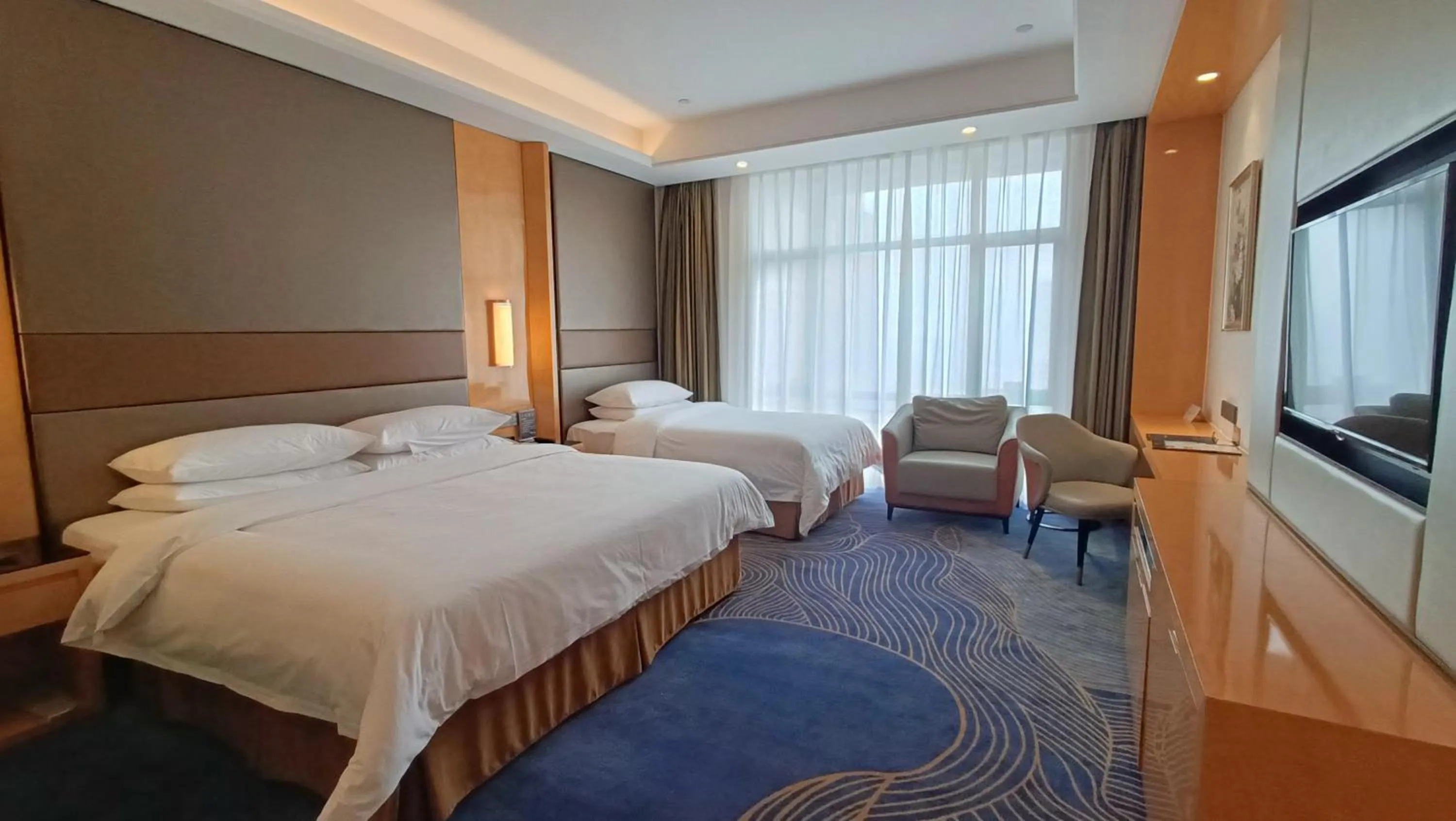 Bed in Vienna International Hotel Jingzhou New World