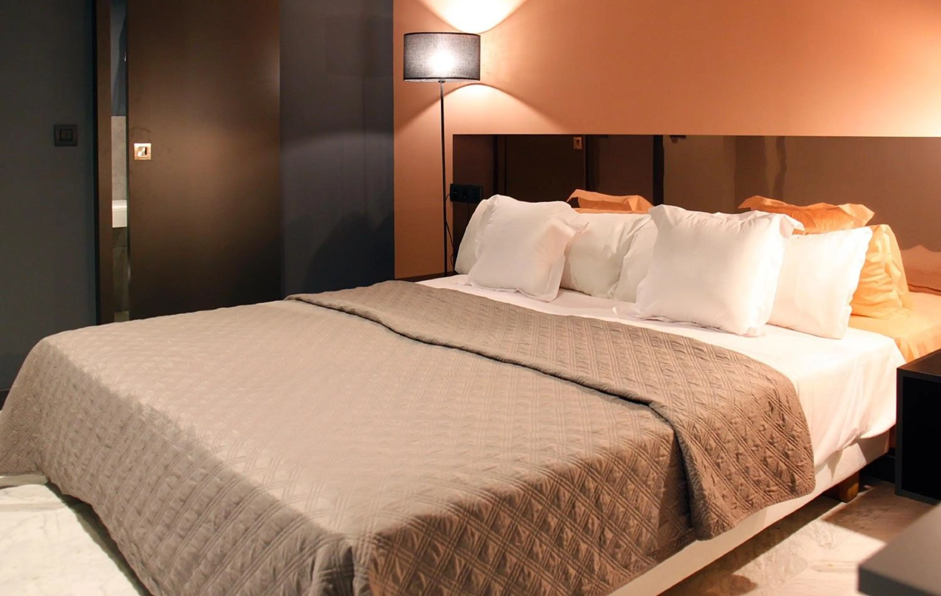 Bedroom, Bed in Apartamentos NONO by Charming Stay