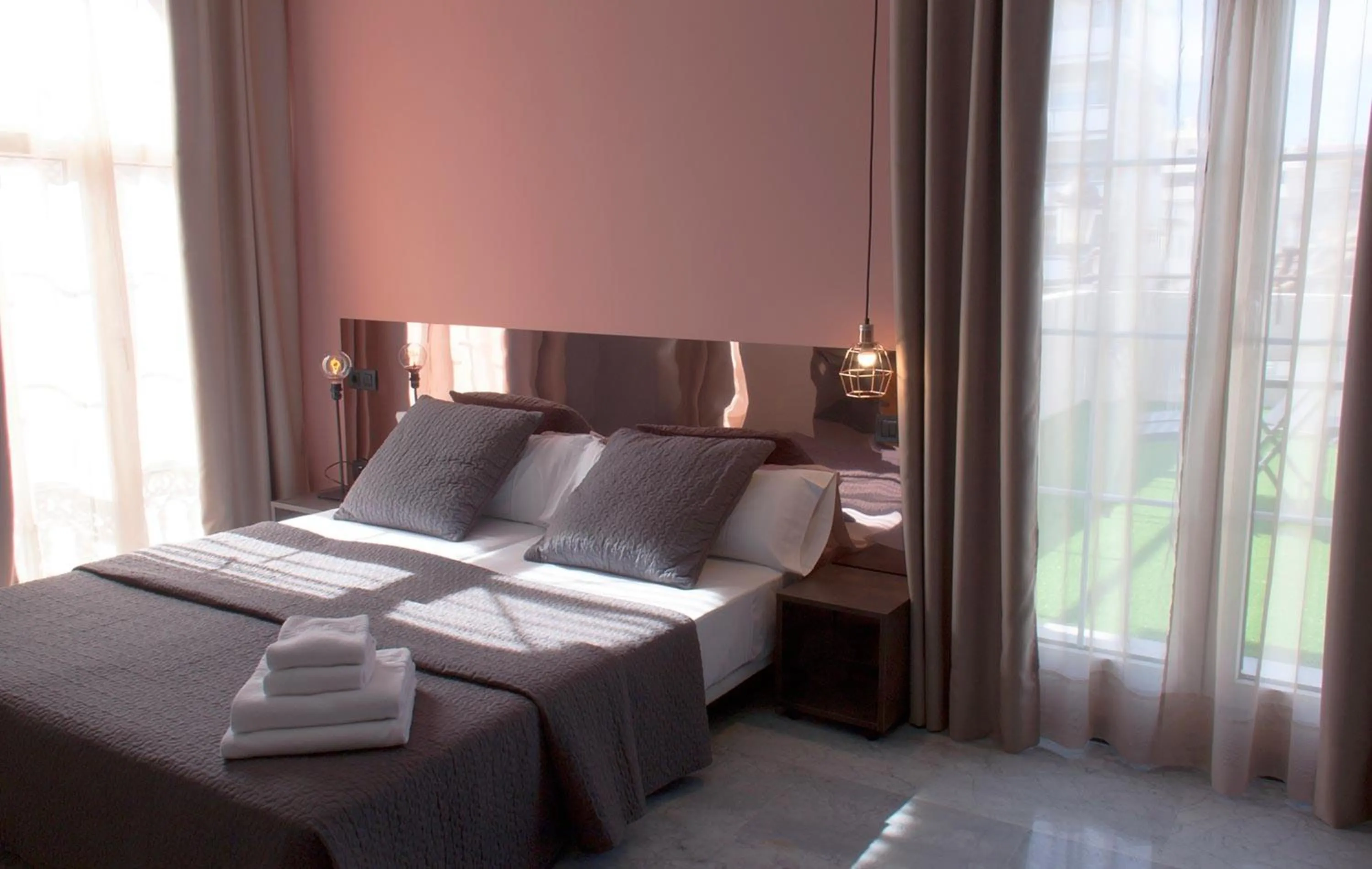 Bedroom, Bed in Apartamentos NONO by Charming Stay