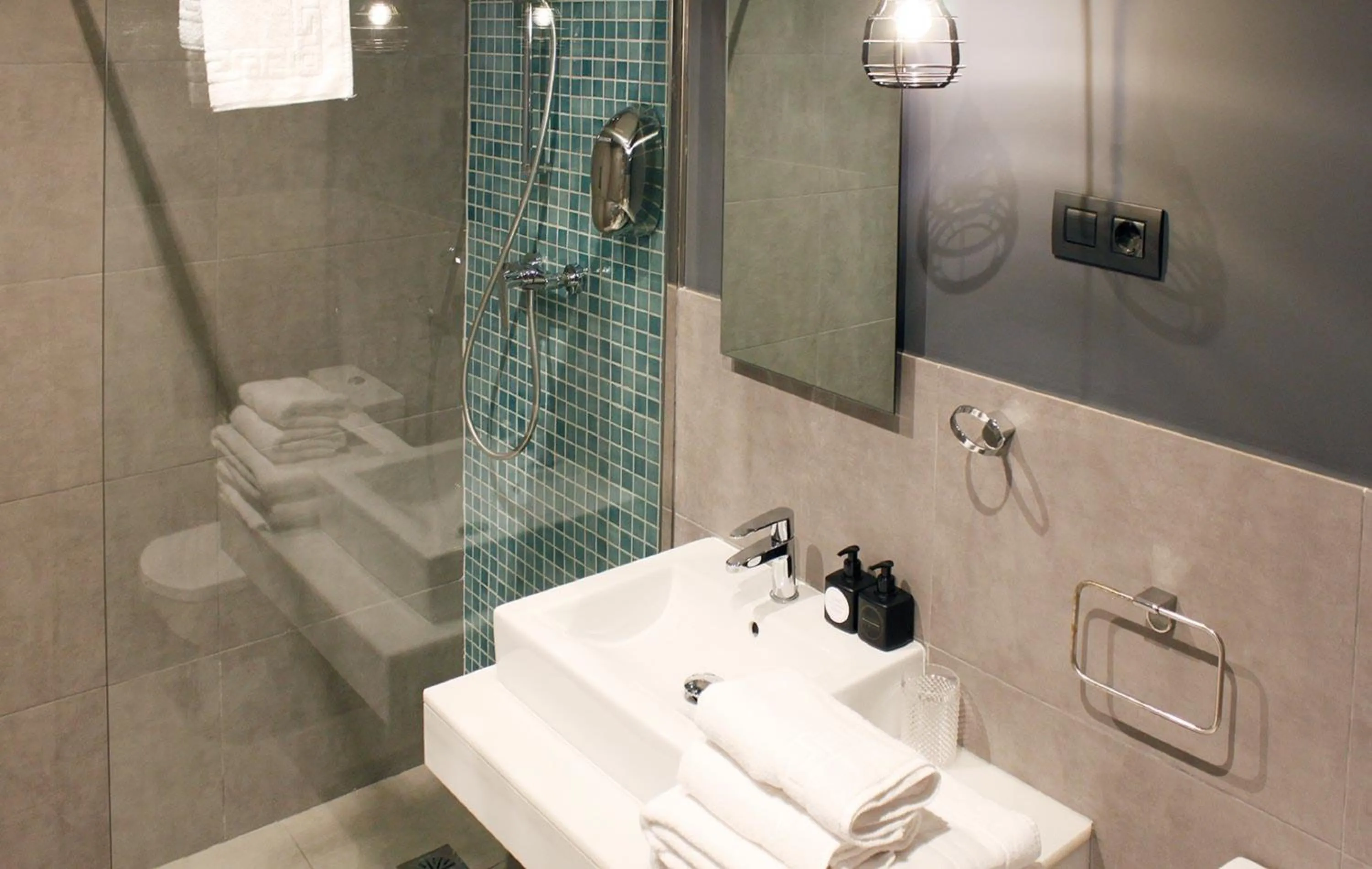 Bathroom in Apartamentos NONO by Charming Stay