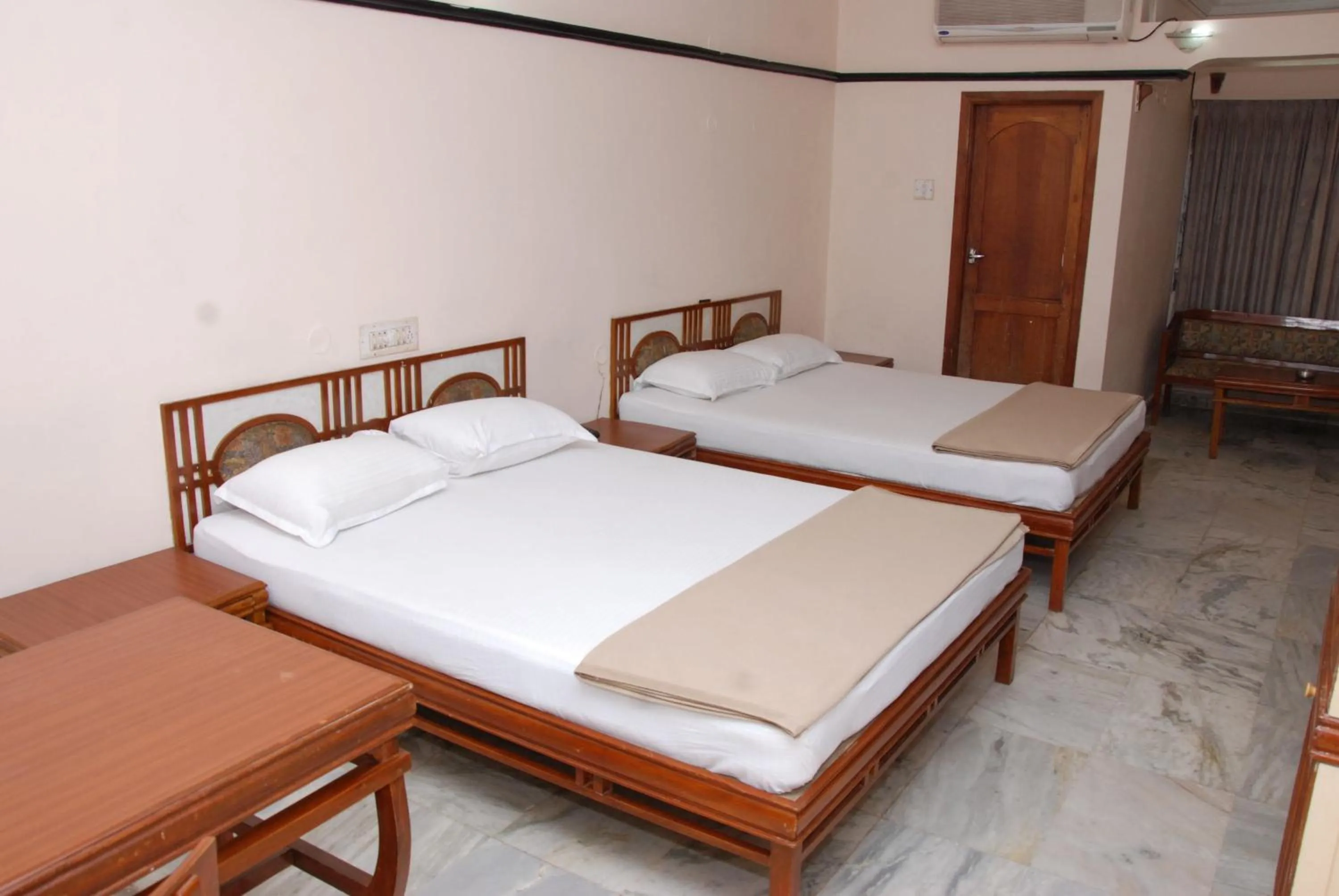 Bed in Amogha International Hotel