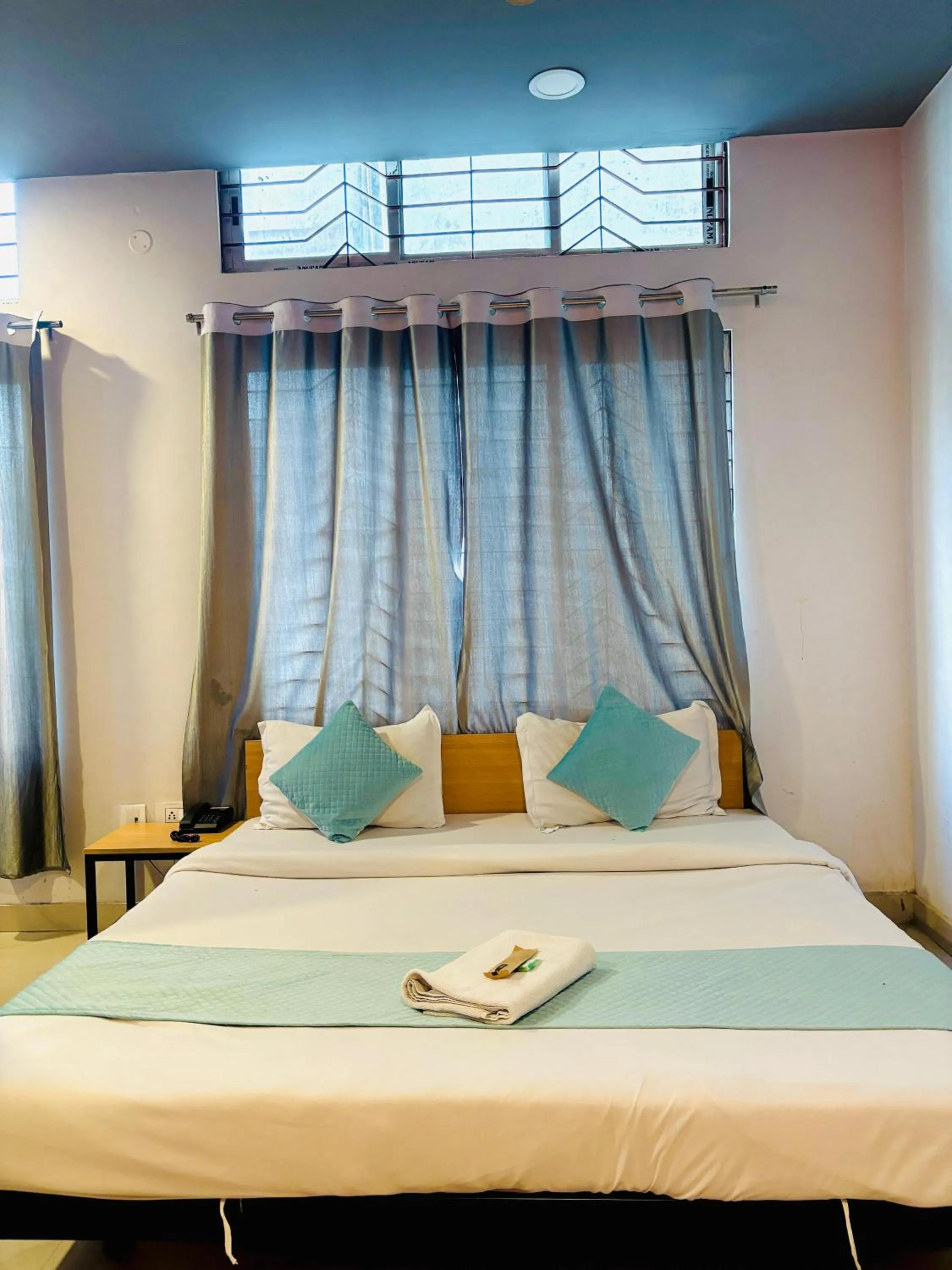 Bed in Hotel Aditya Guwahati