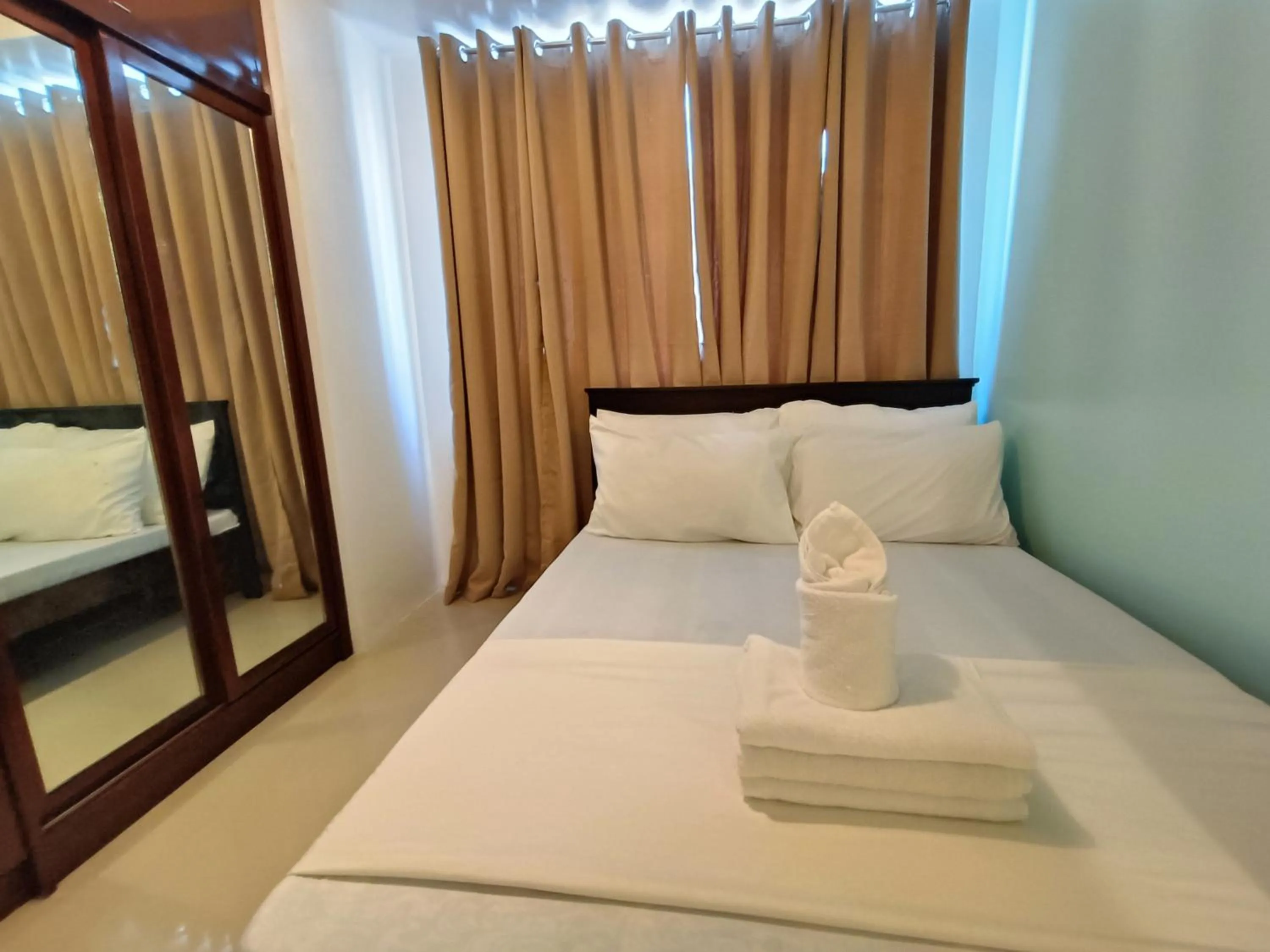 Bed in Premiere Haven MOA Staycation