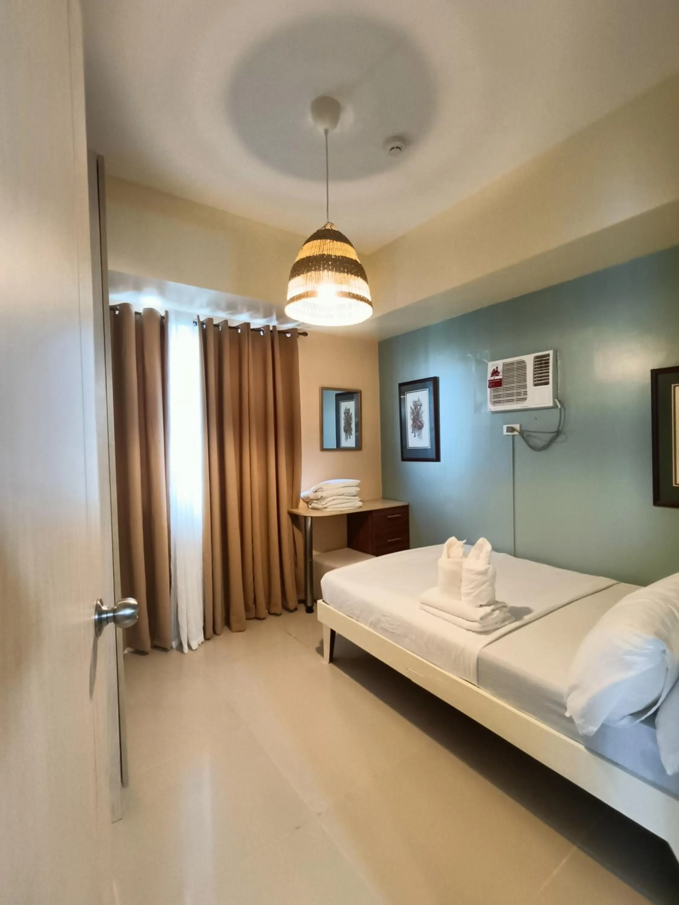 Bed in Premiere Haven MOA Staycation