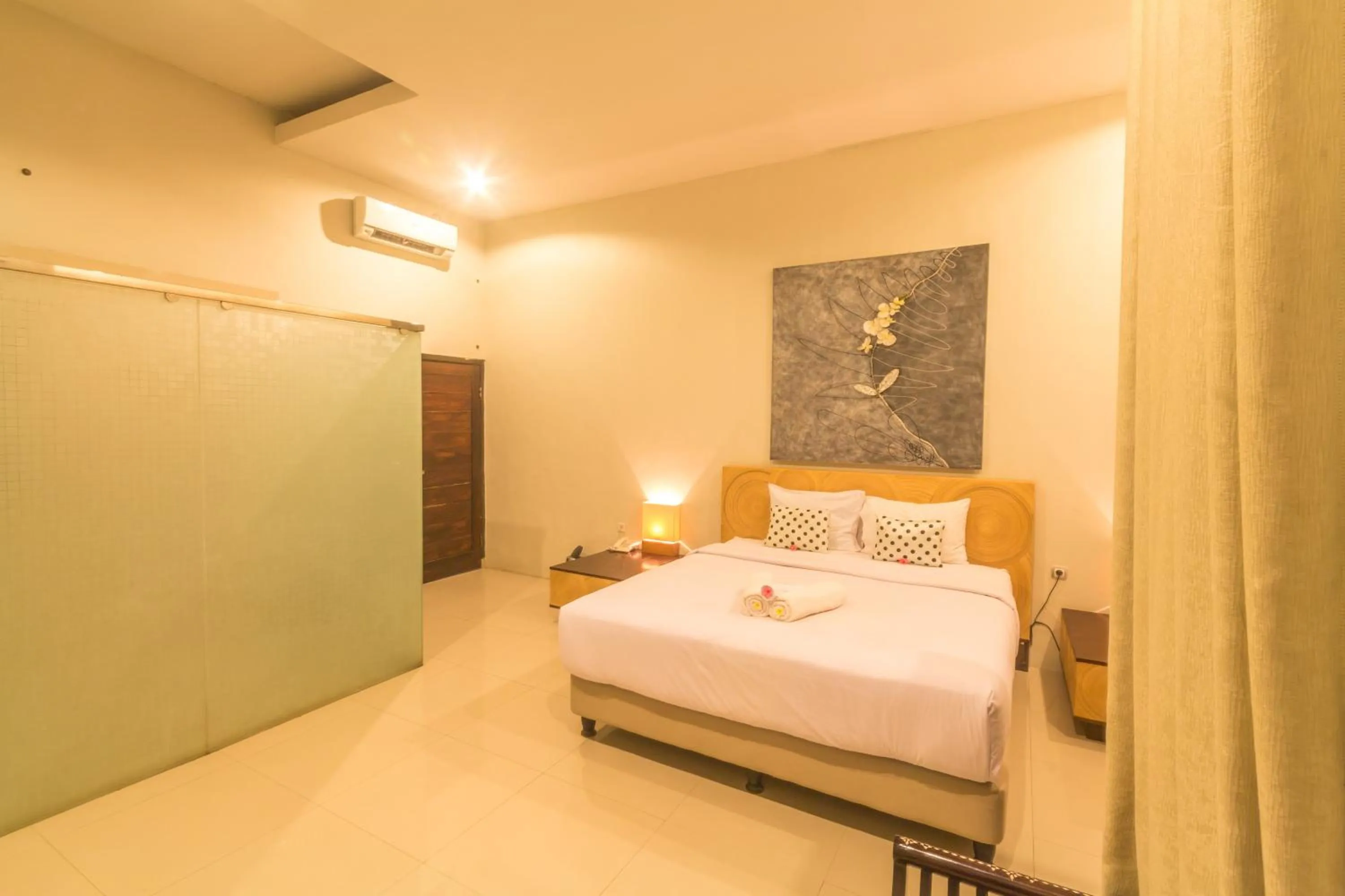 Photo of the whole room, Bed in JM Hotel Kuta Lombok