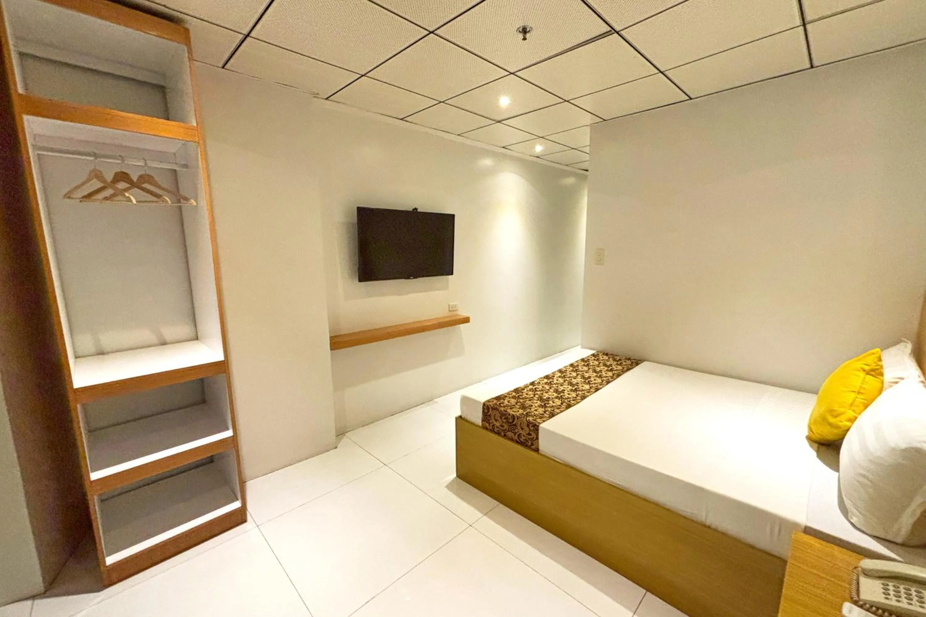 Bed in LuxeLite Suites Pasay