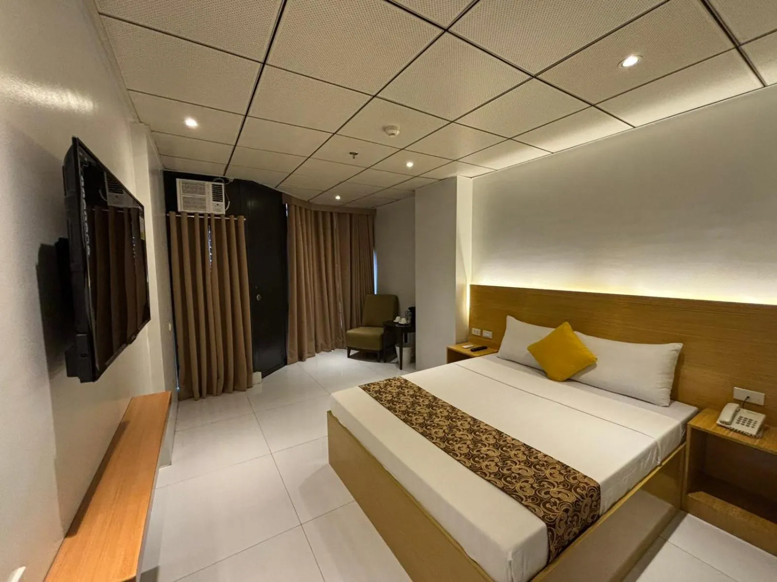 Bed in LuxeLite Suites Pasay