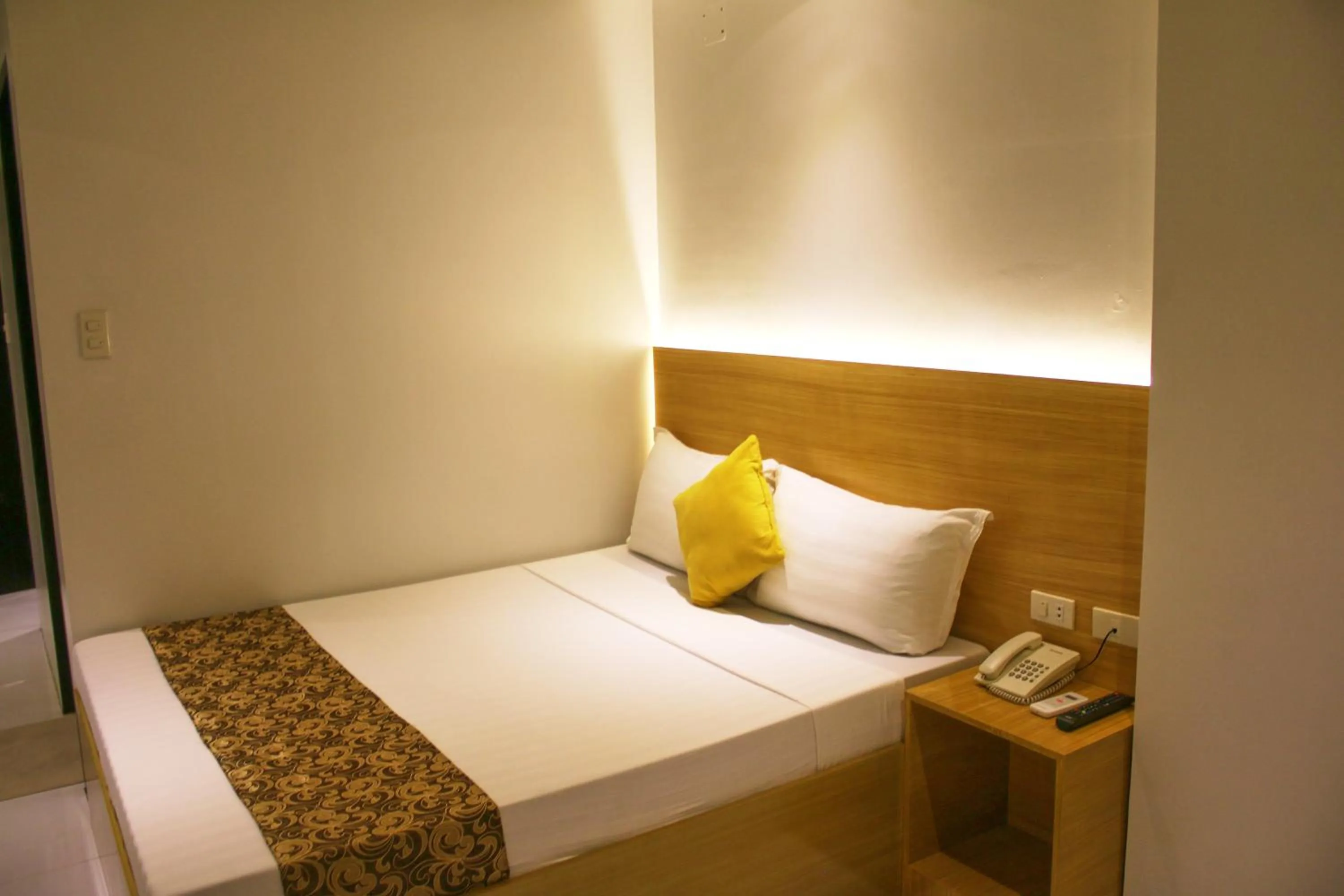 Bed in LuxeLite Suites Pasay