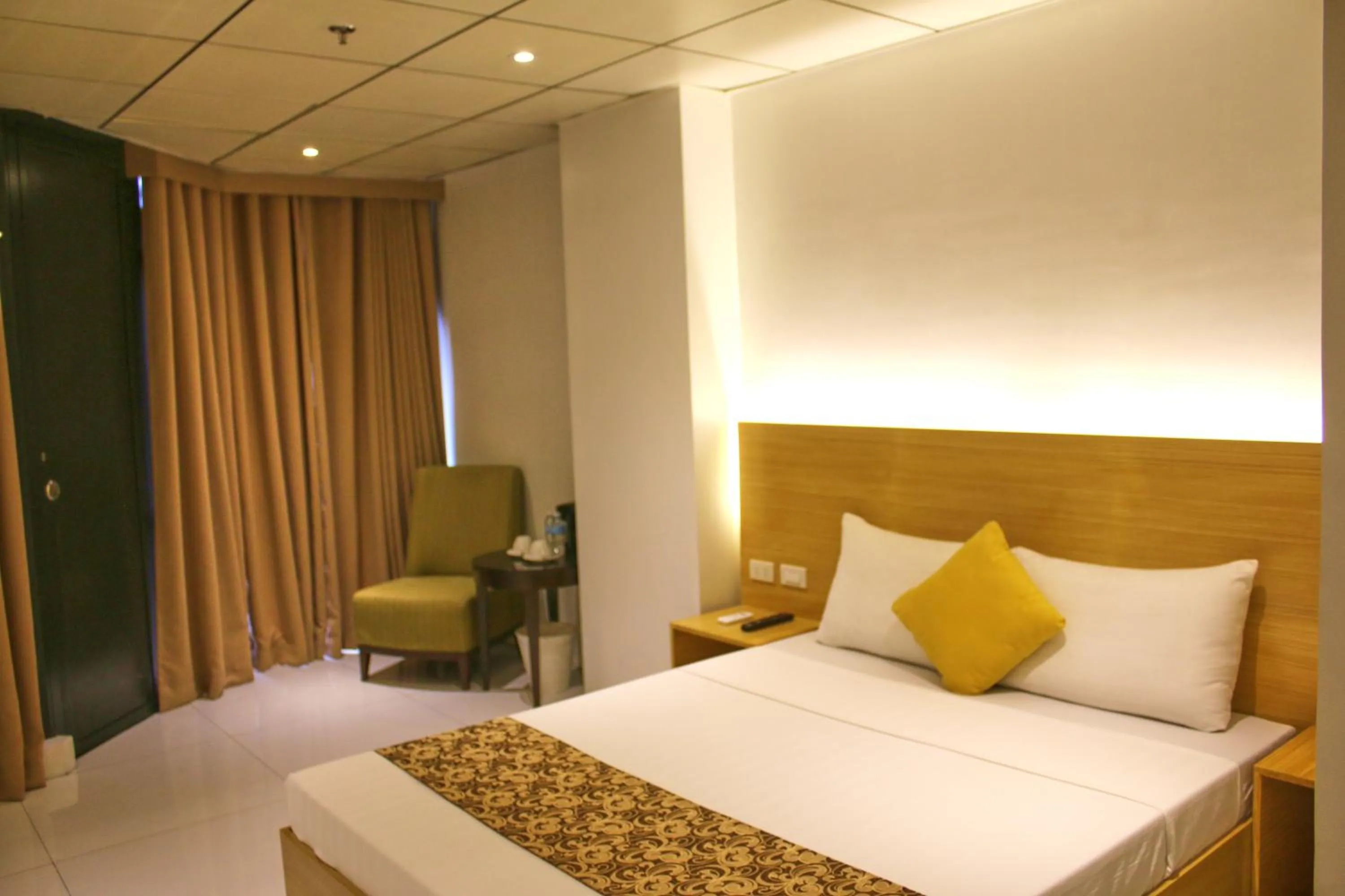 Bed in LuxeLite Suites Pasay