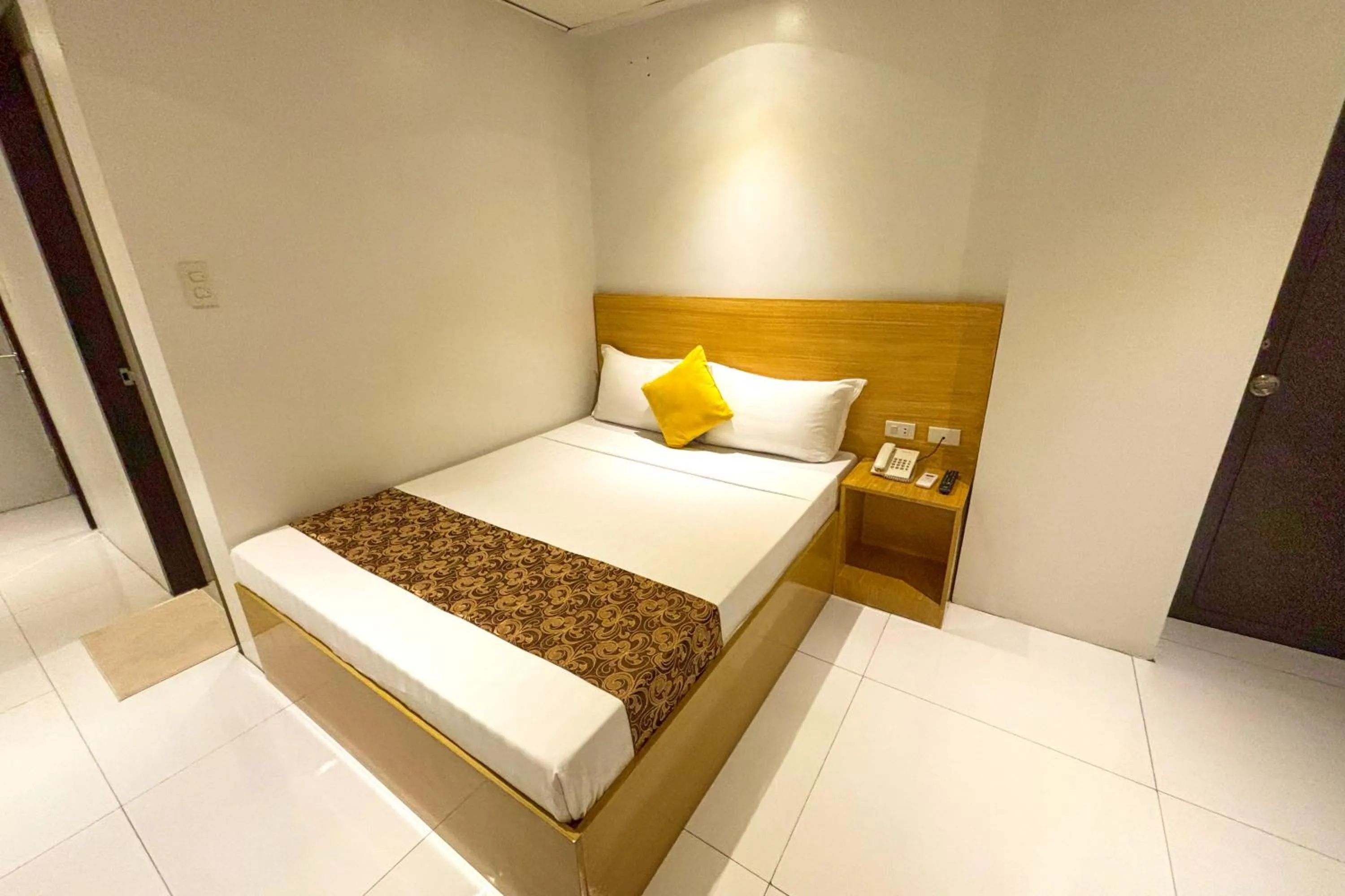 Bed in LuxeLite Suites Pasay