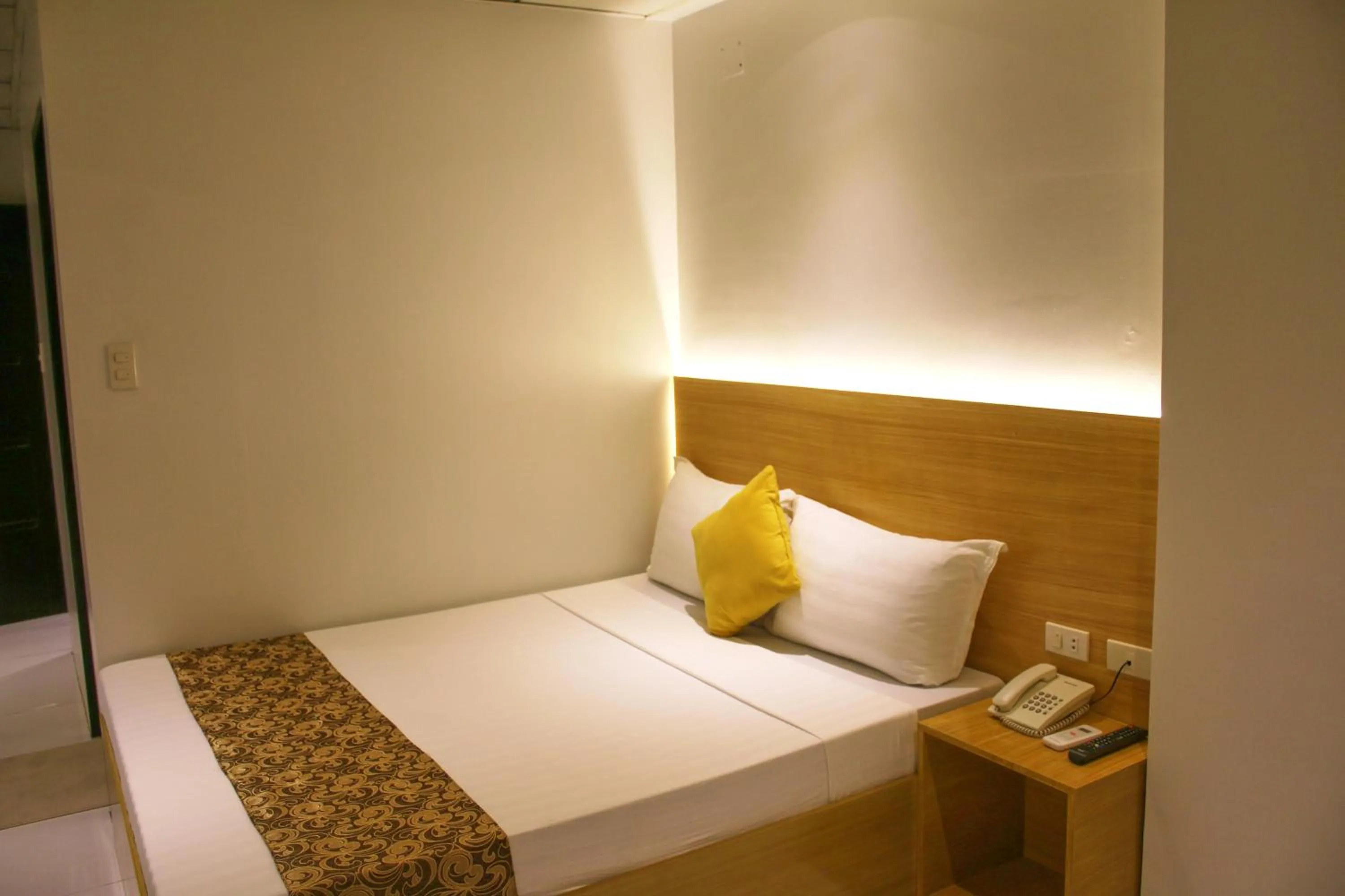 Bed in LuxeLite Suites Pasay