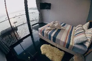 Bed in Sea Sand Trees