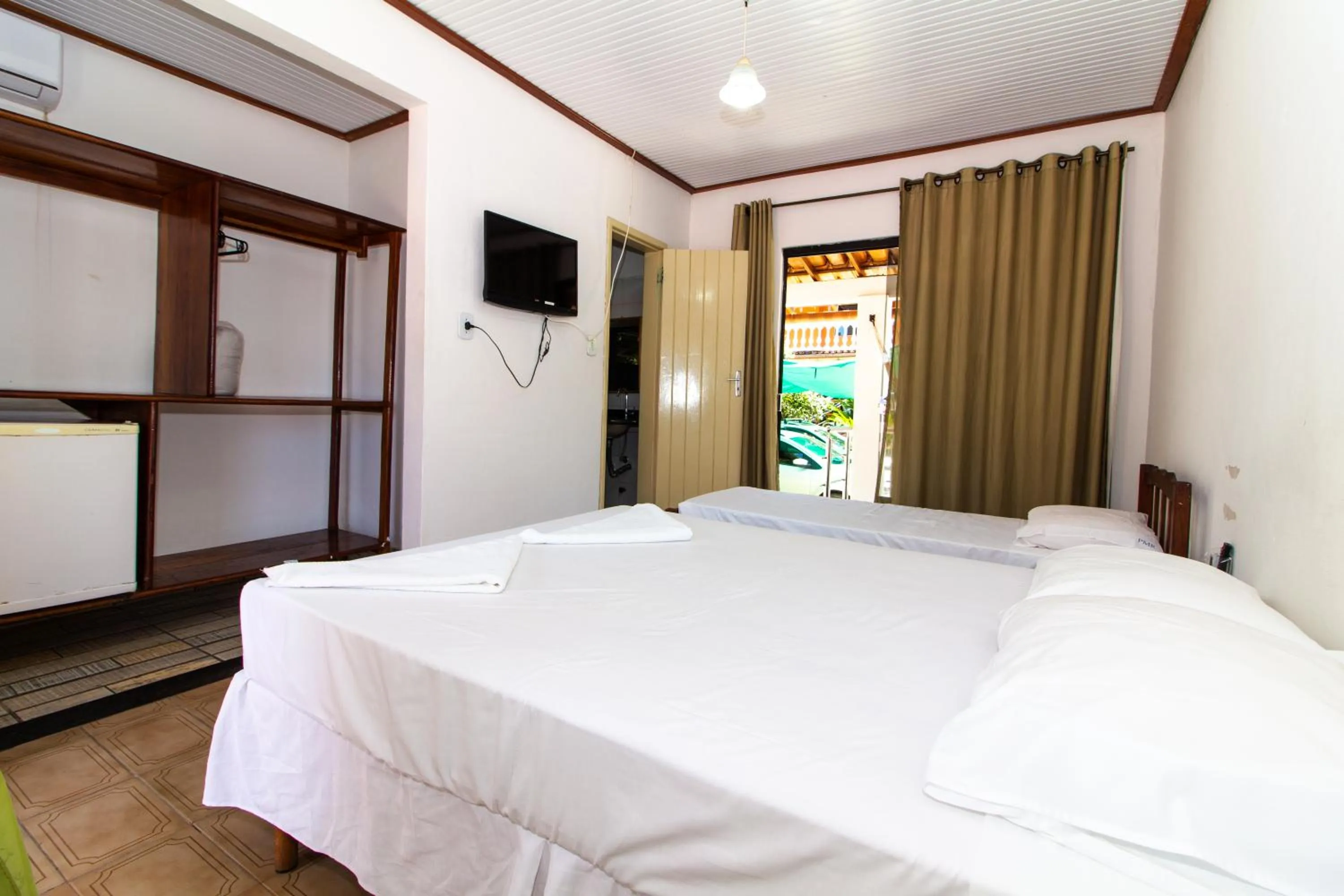 Bed in Pousada Manga Rosa- Arraial