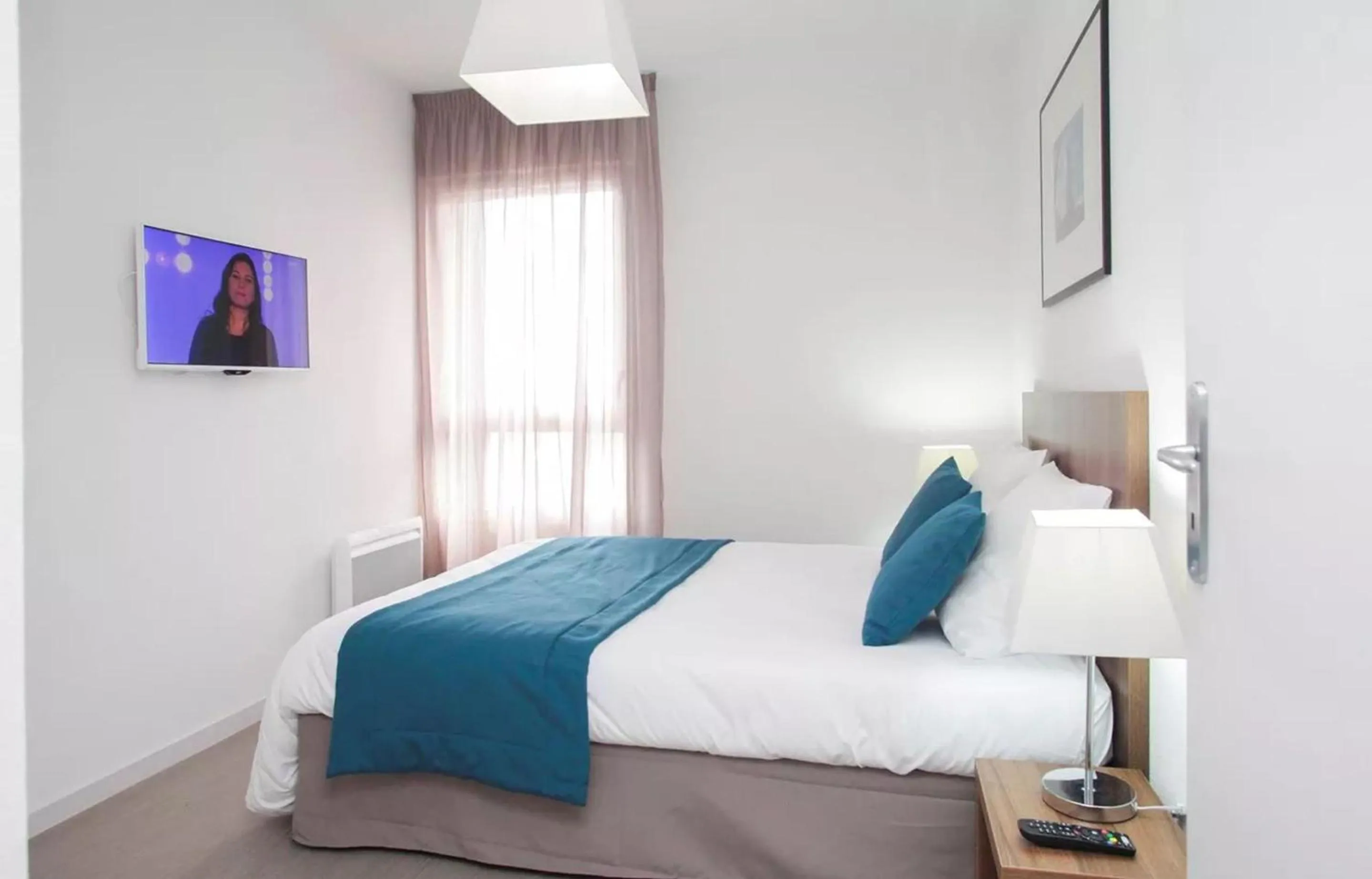 Bedroom, Bed in Appart'hôtel Odalys City - Orléans Centre