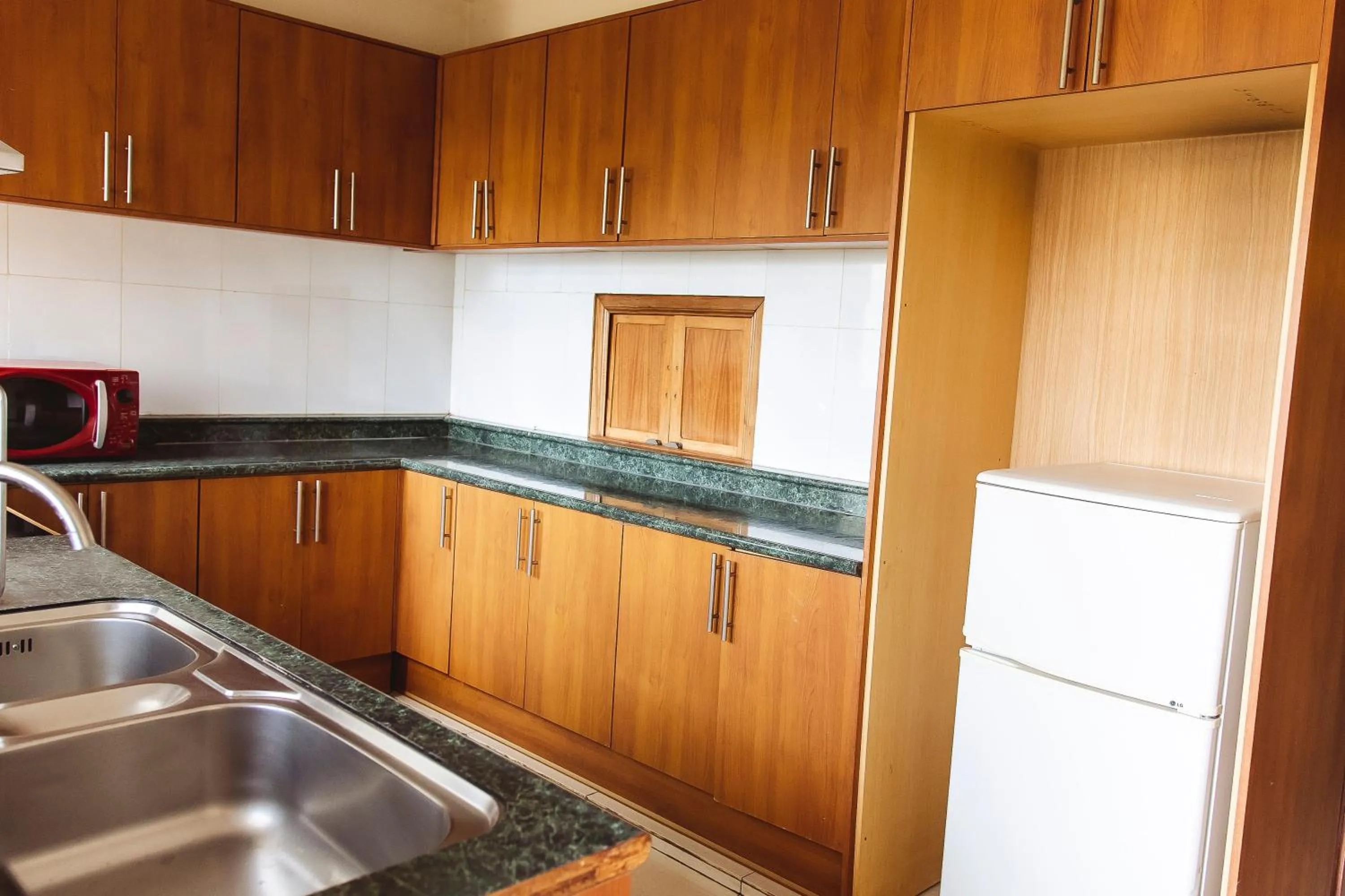 Kitchen or kitchenette in Highlands Apartment