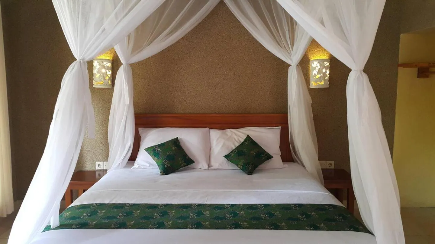 Bed in Mango Tree Inn