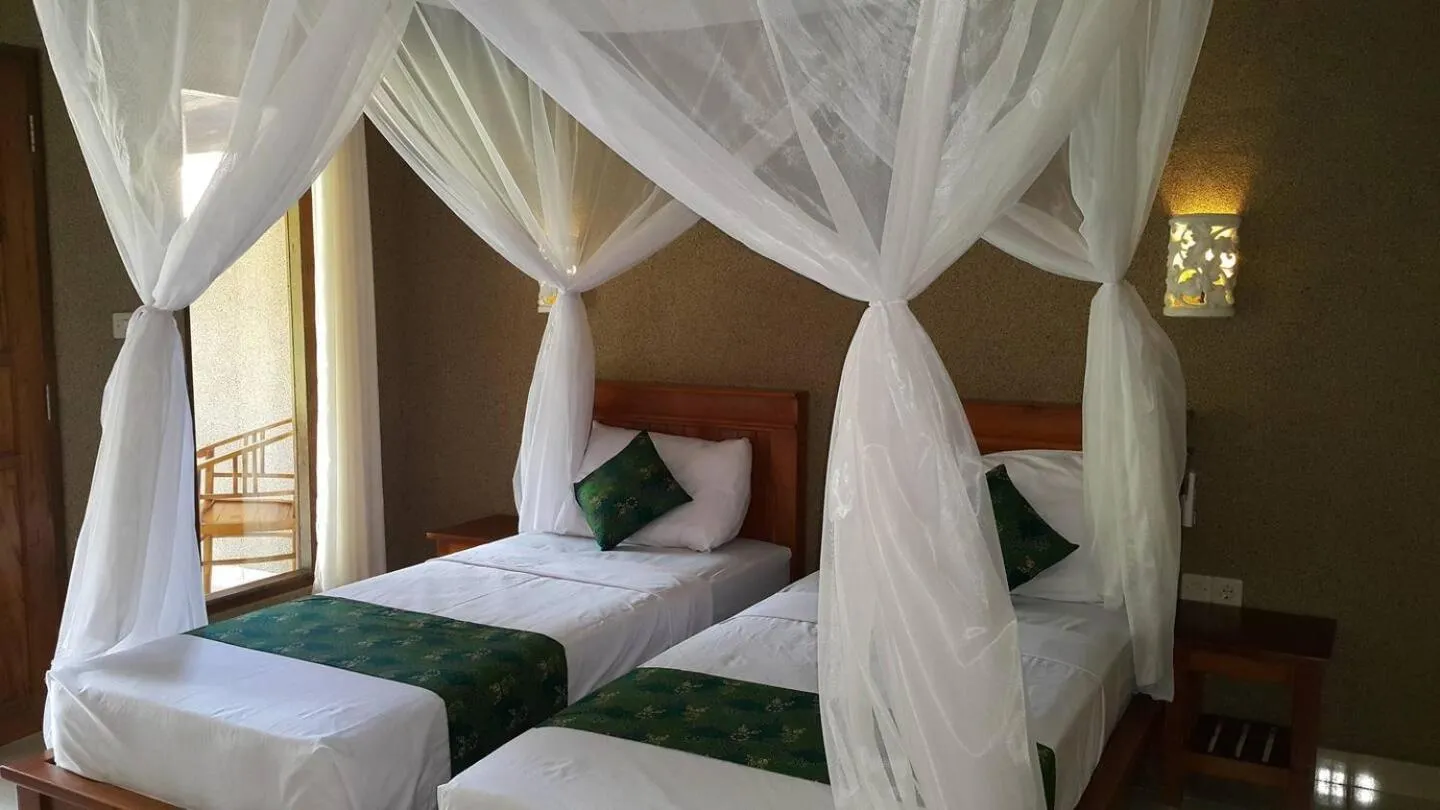 Bed in Mango Tree Inn