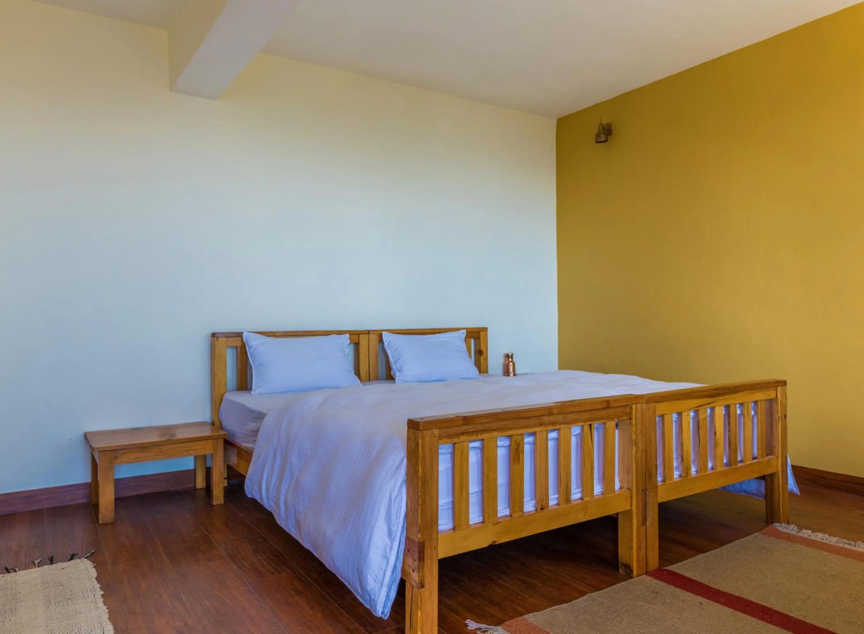 Bed in Kasar Rainbow Yoga Retreat