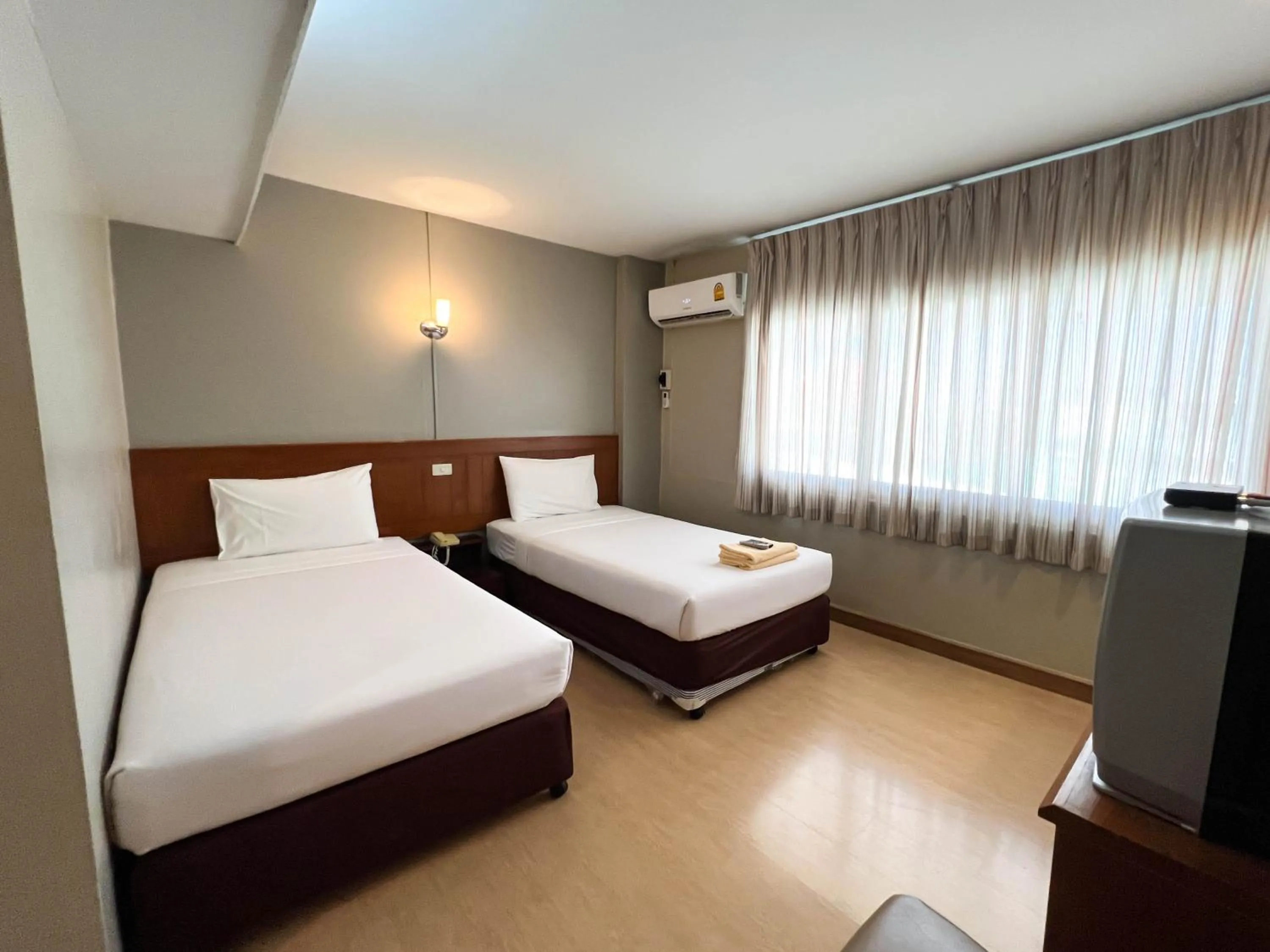 Bed in Srivichai Hotel