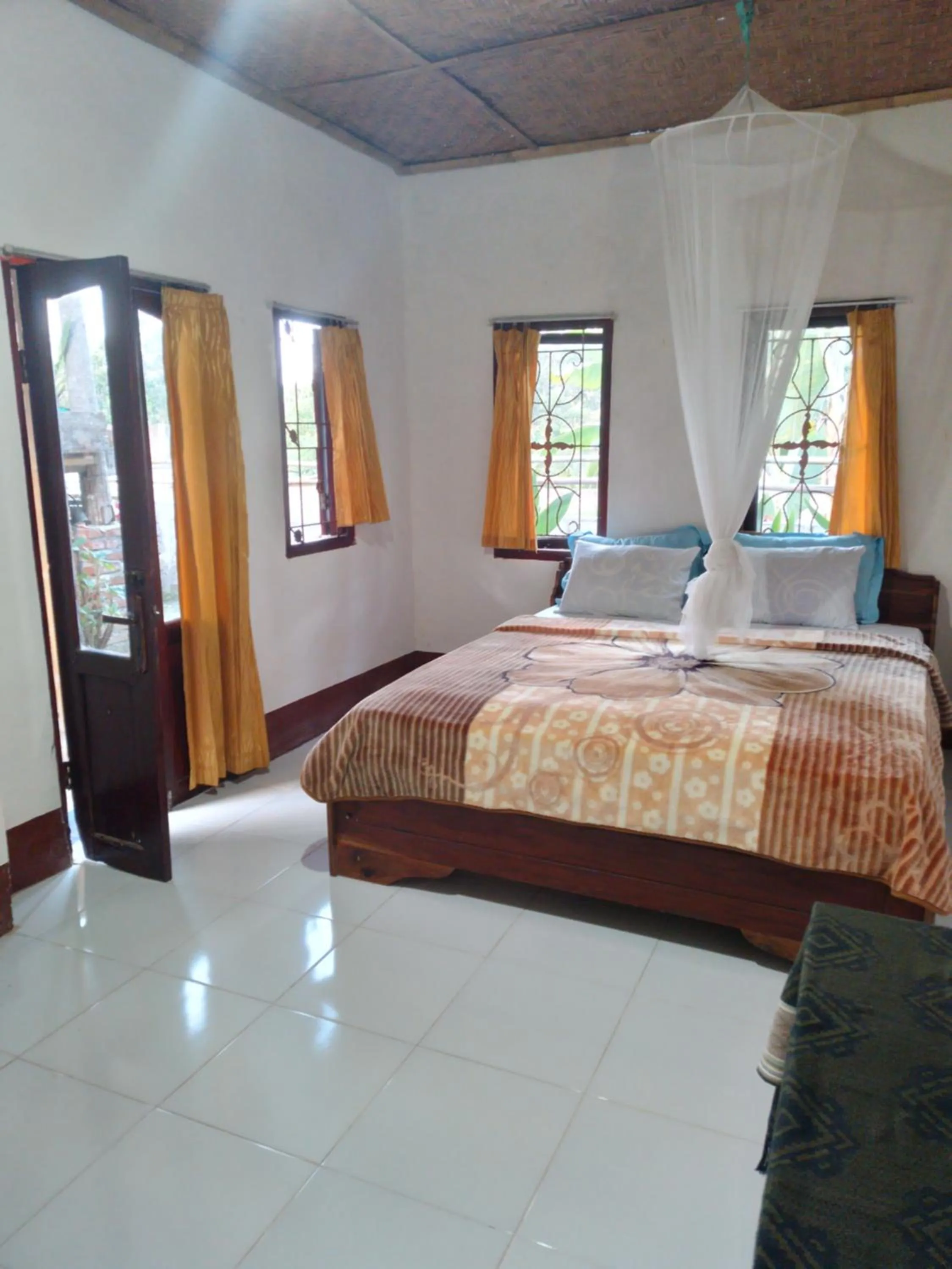 Photo of the whole room, Bed in Kembang Kuning Cottages