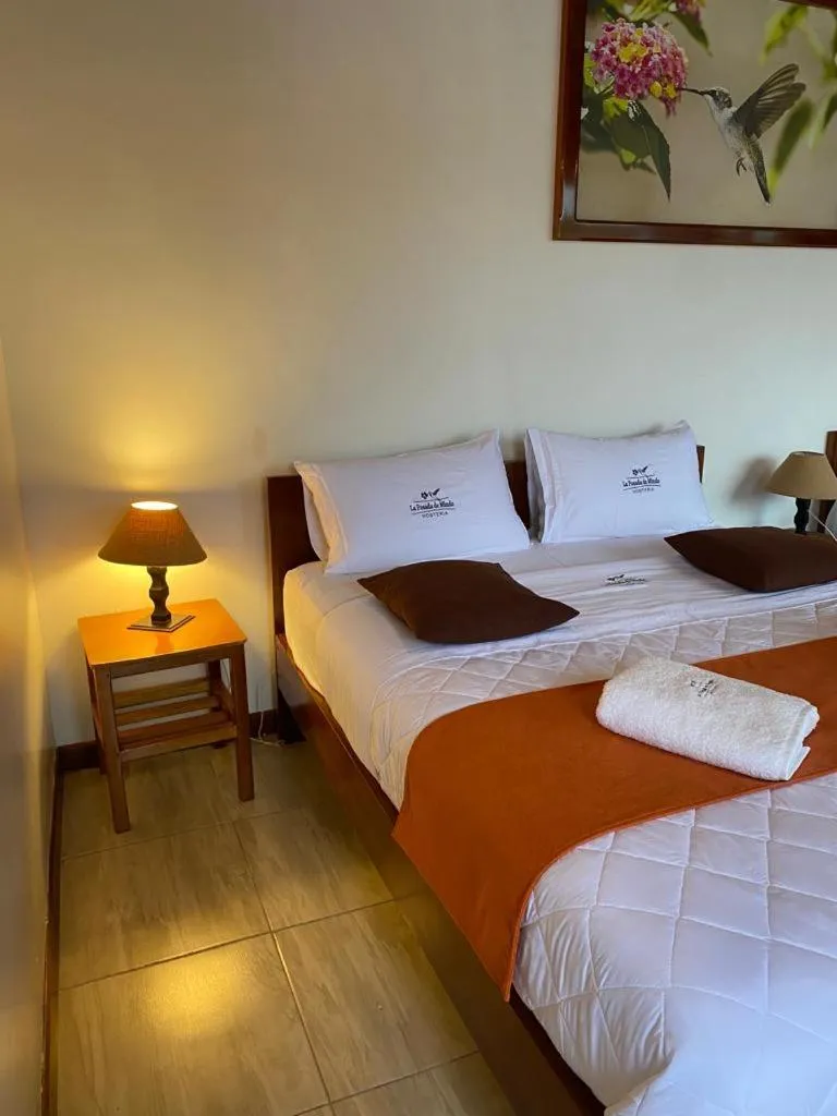 Bed in La Posada de Mindo