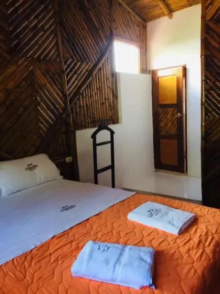 Bed in La Posada de Mindo