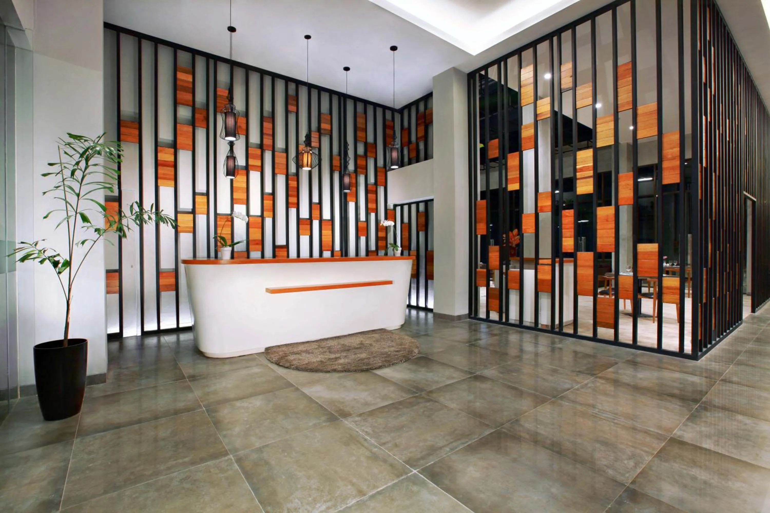 Lobby or reception in Harper Purwakarta by ASTON