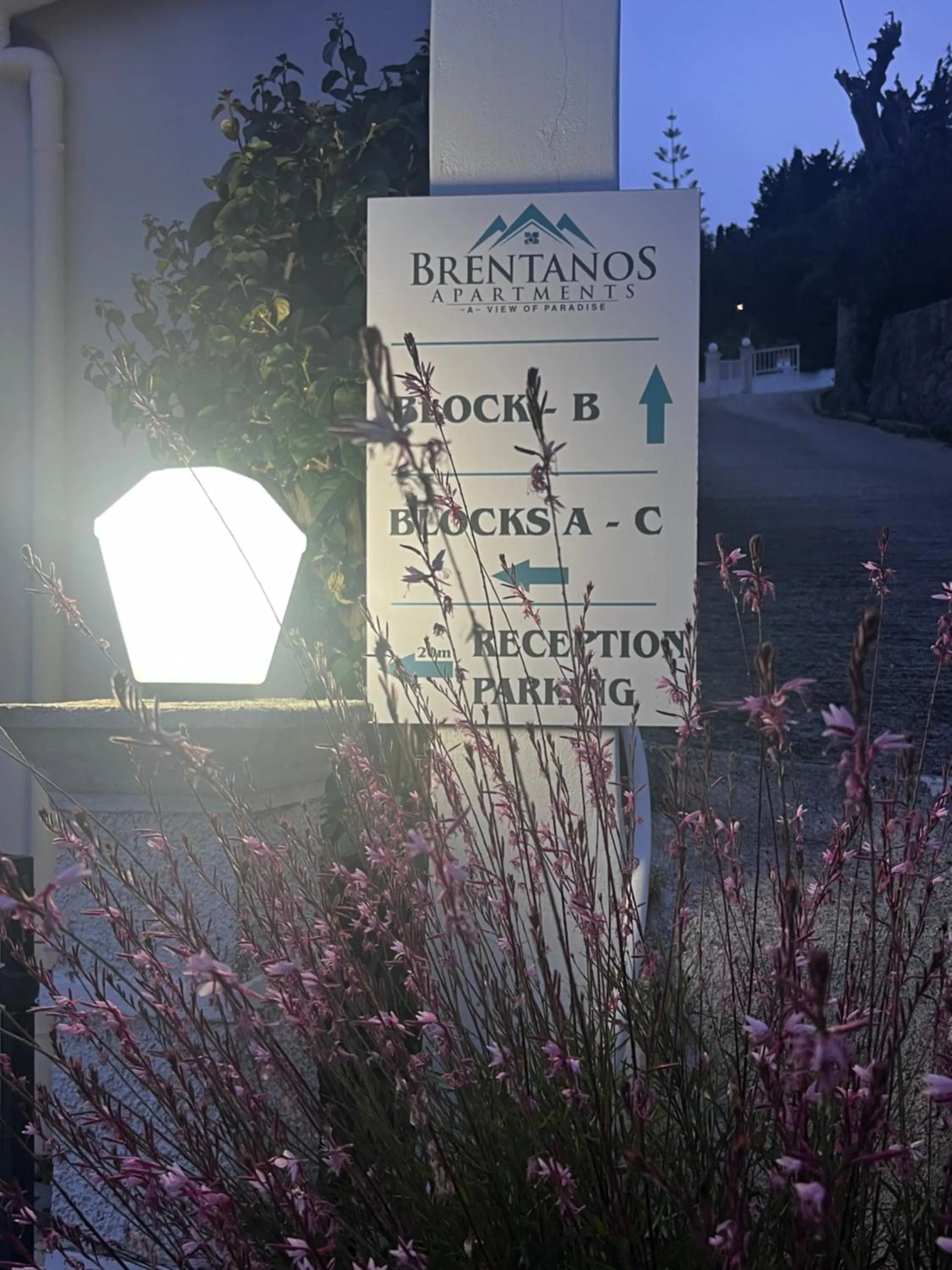 Property logo or sign in Brentanos Apartments - A - View of Paradise