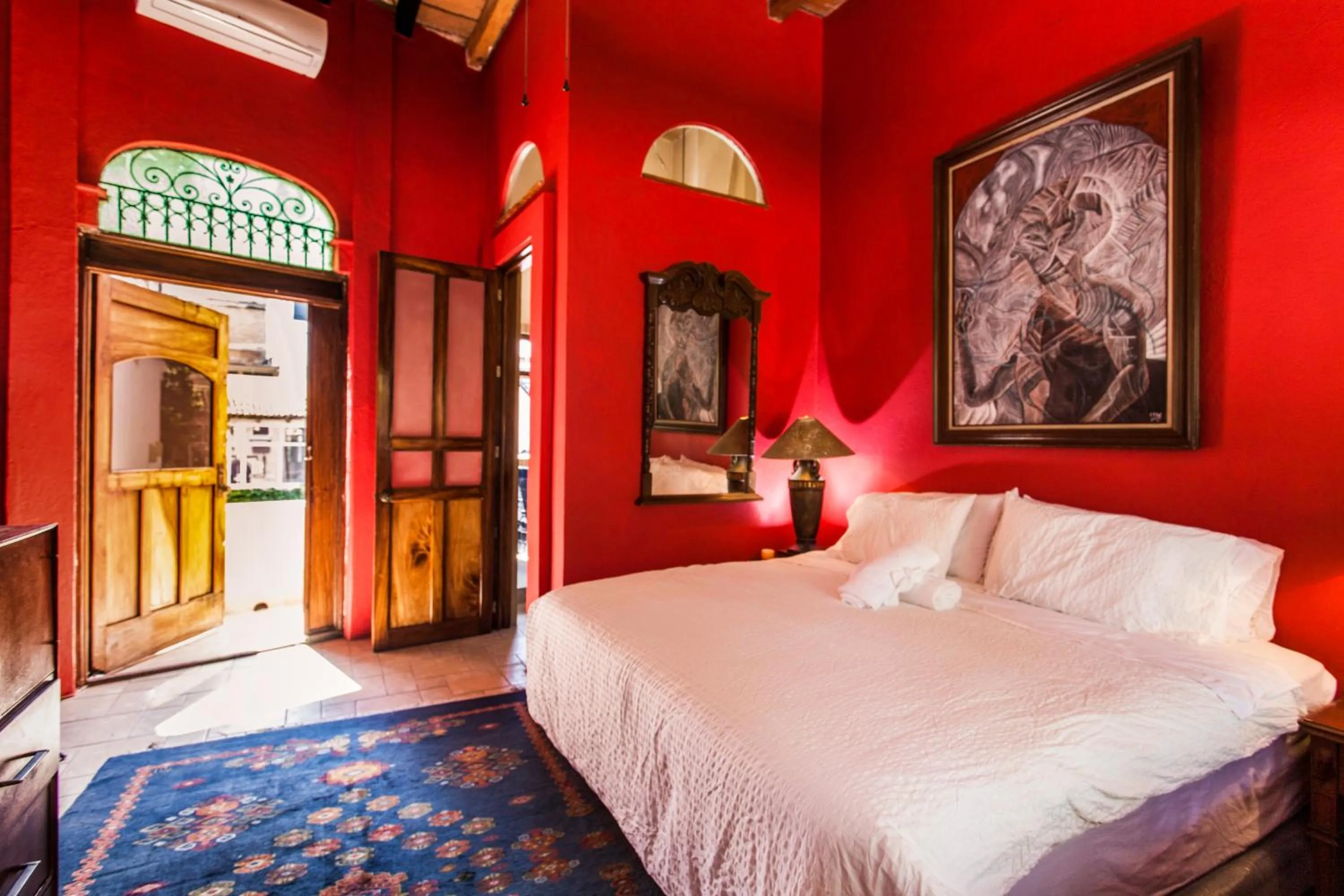 Bed in Garlands Del Rio Riverside Boutique Hotel